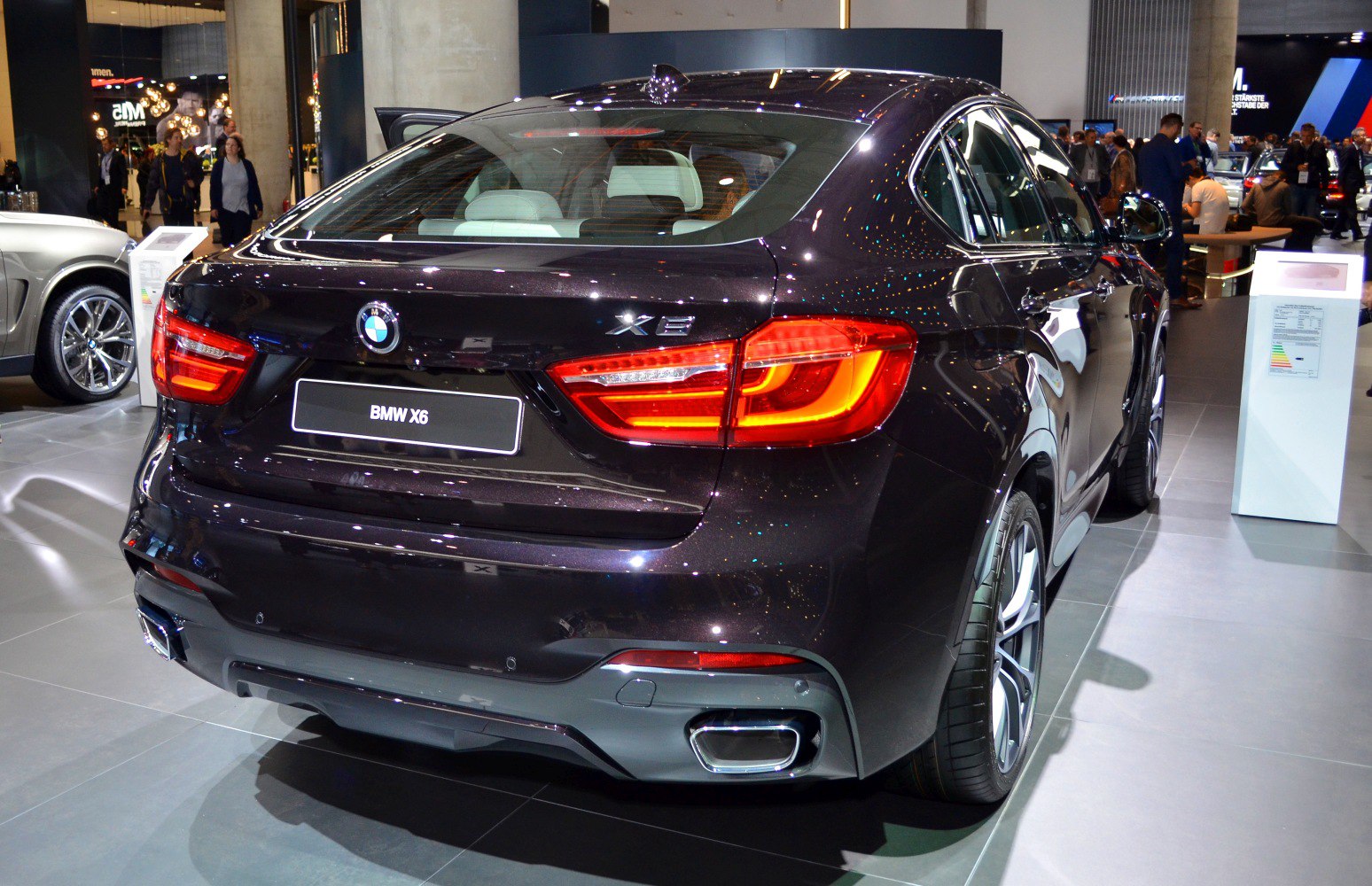 Rear view with LED tail lights and dual exhaust pipes.