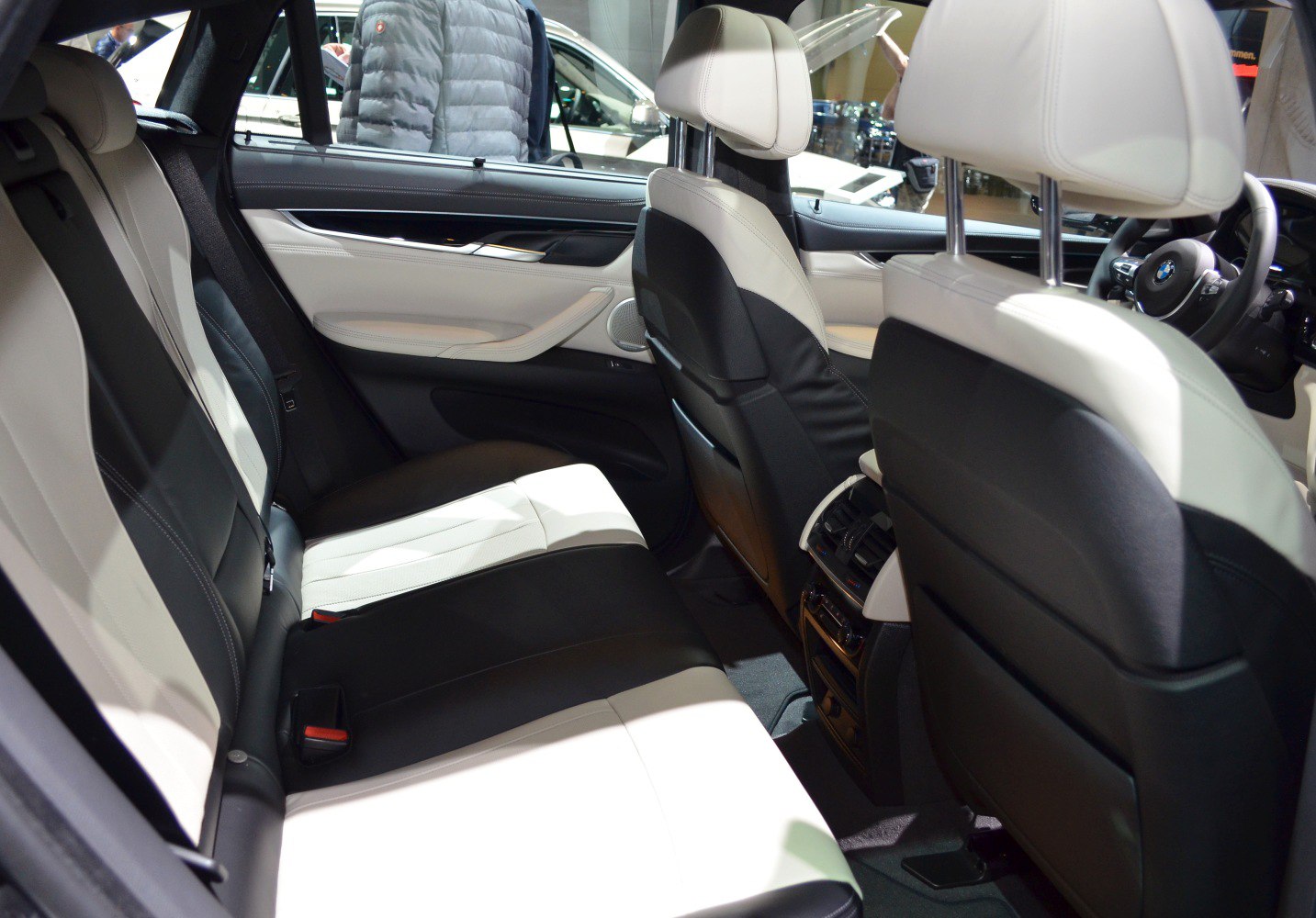 Two-tone leather rear seats with spacious legroom and detailed door panel.
