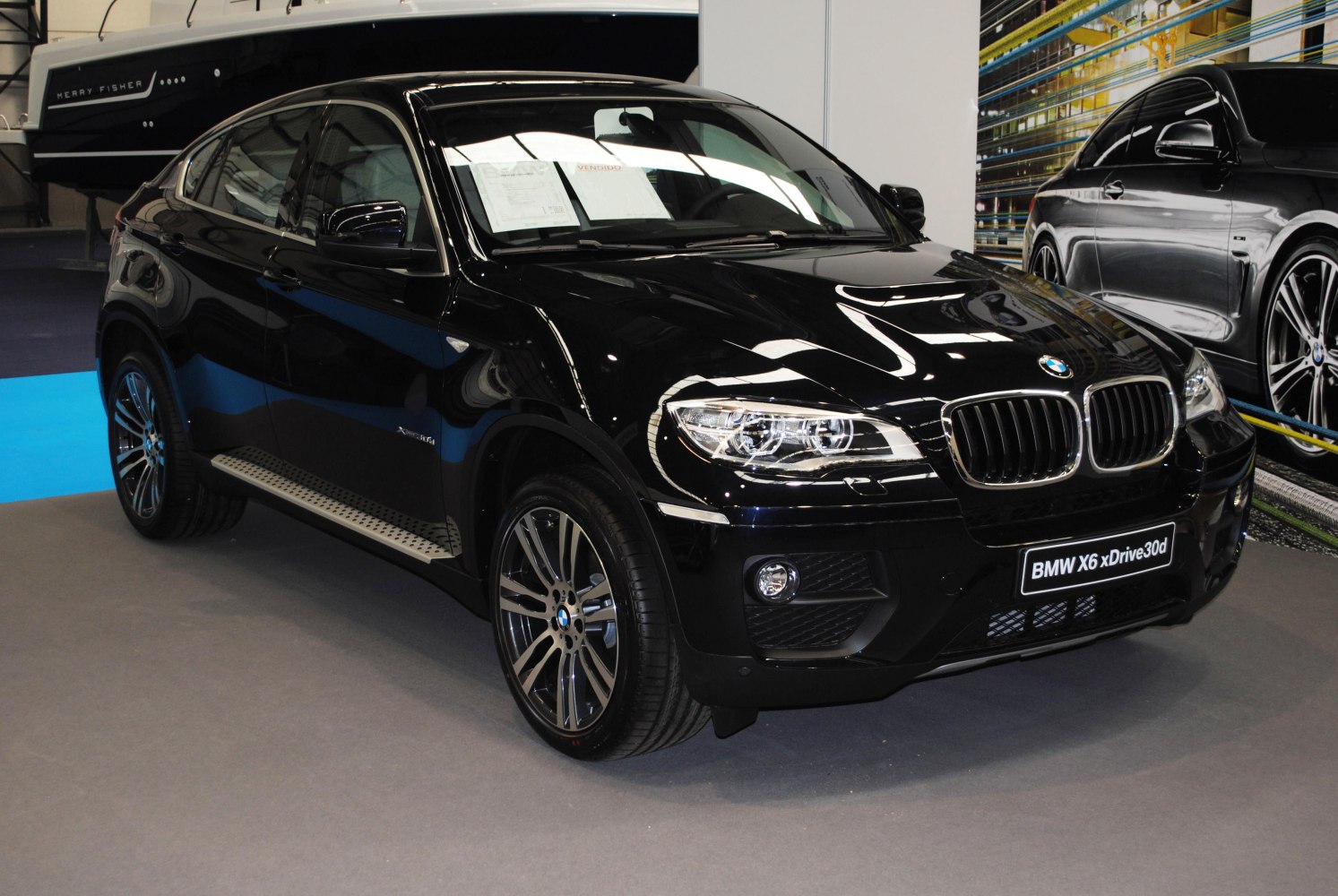 Front view with distinctive headlights and alloy wheels