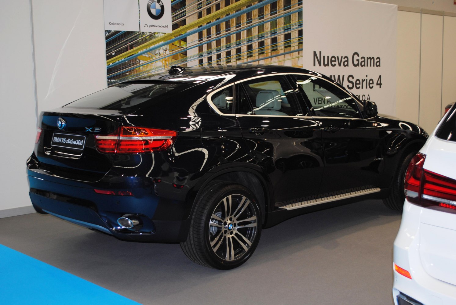 Rear side view of black SUV with alloy wheels and LED taillights