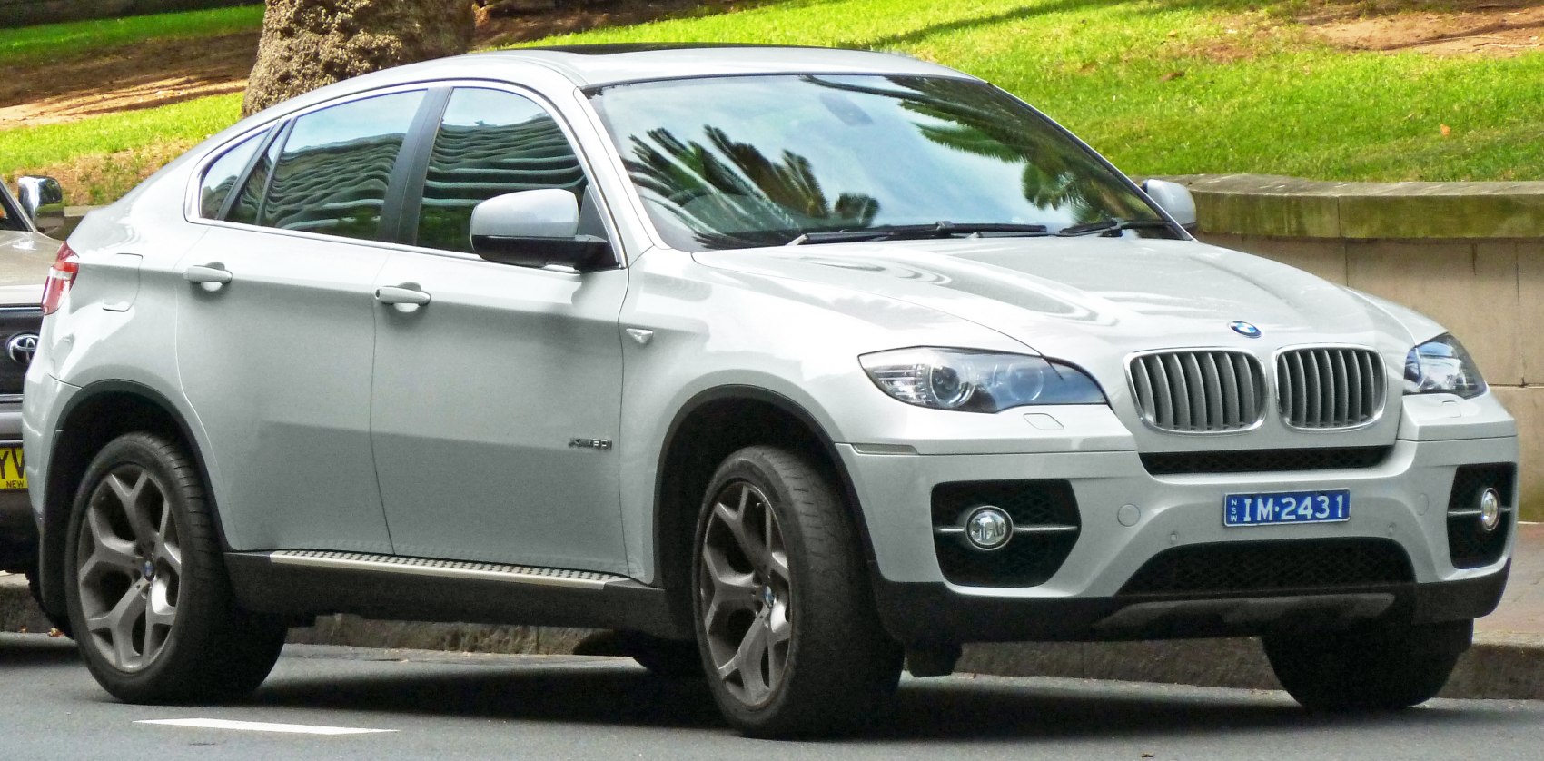 Silver SUV with signature kidney grille and alloy wheels front side view.