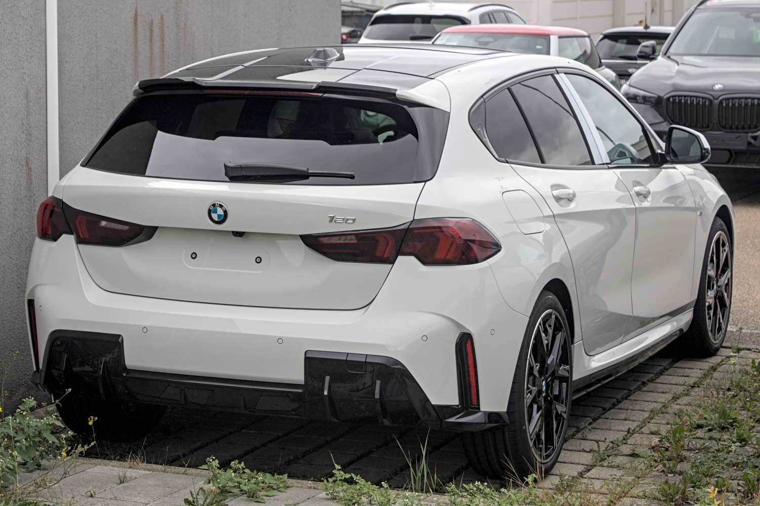 Rear view of hatchback with tail lights and sporty diffuser