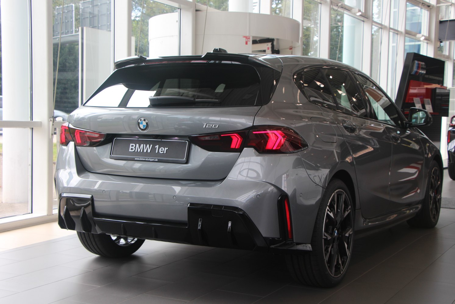 Rear view of hatchback with modern LED taillights and sporty diffuser