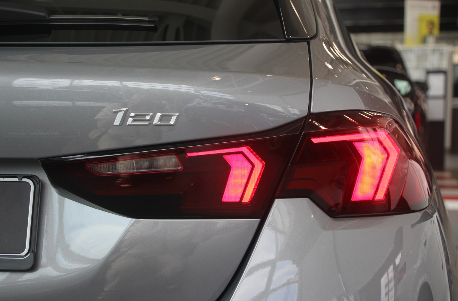 Rear tail light and 120 badge close-up on hatchback