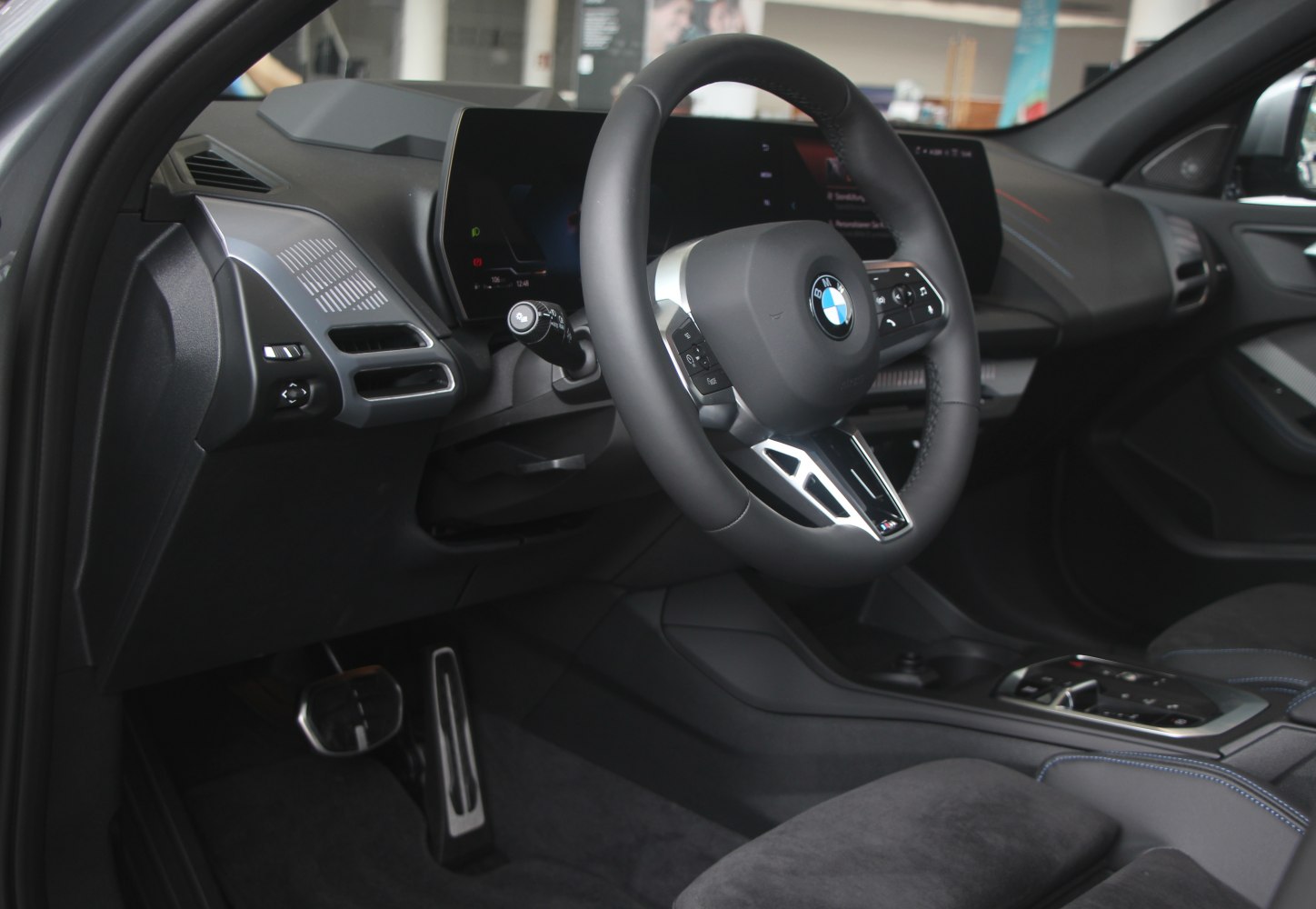 Modern car interior with digital cockpit and multifunction steering wheel