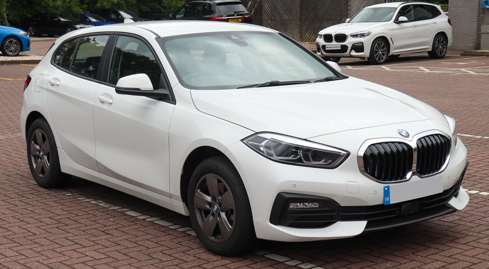 Front and side view of hatchback with kidney grille and LED headlights