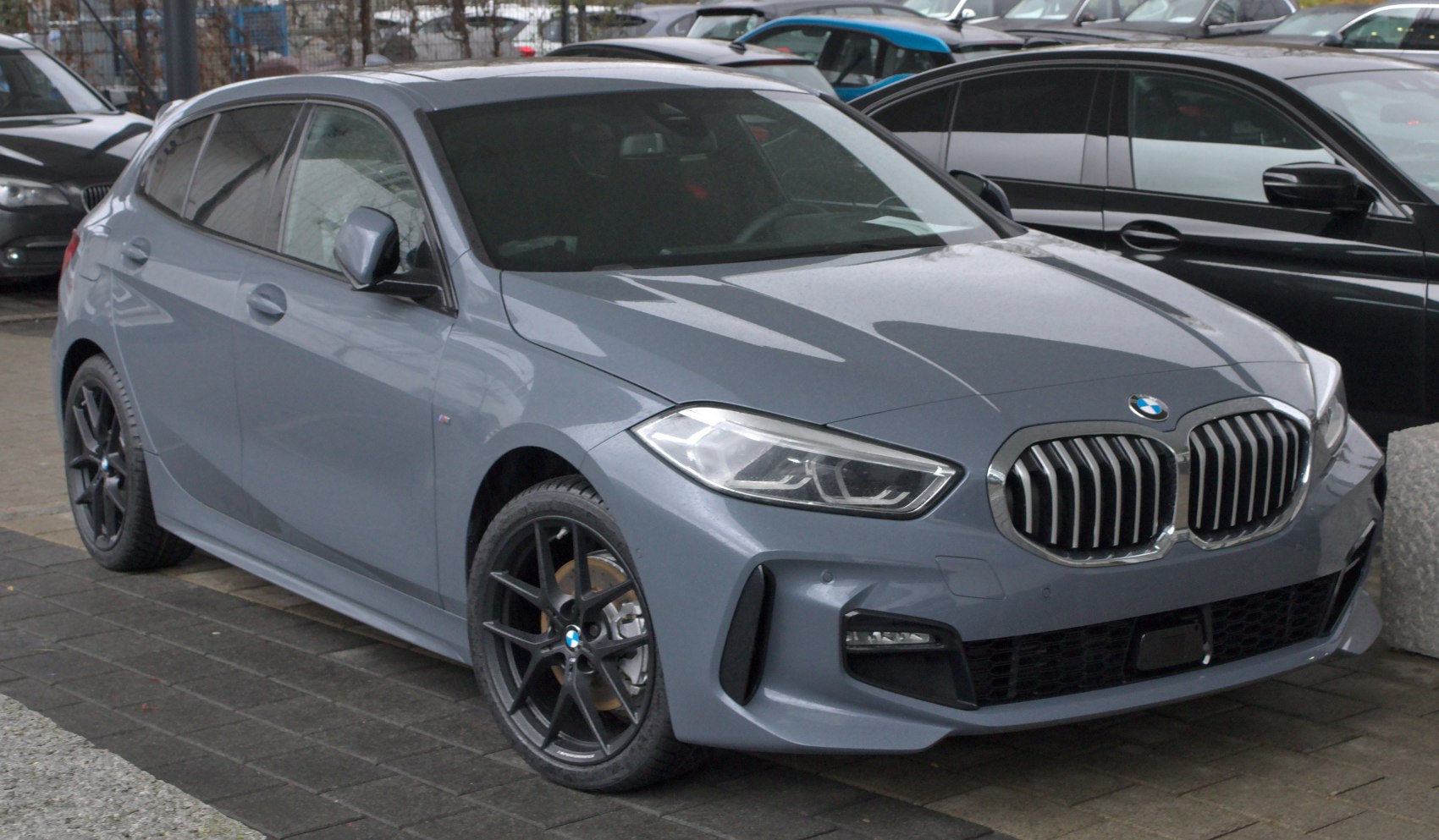 Front grille, headlights, and alloy wheels of a modern hatchback