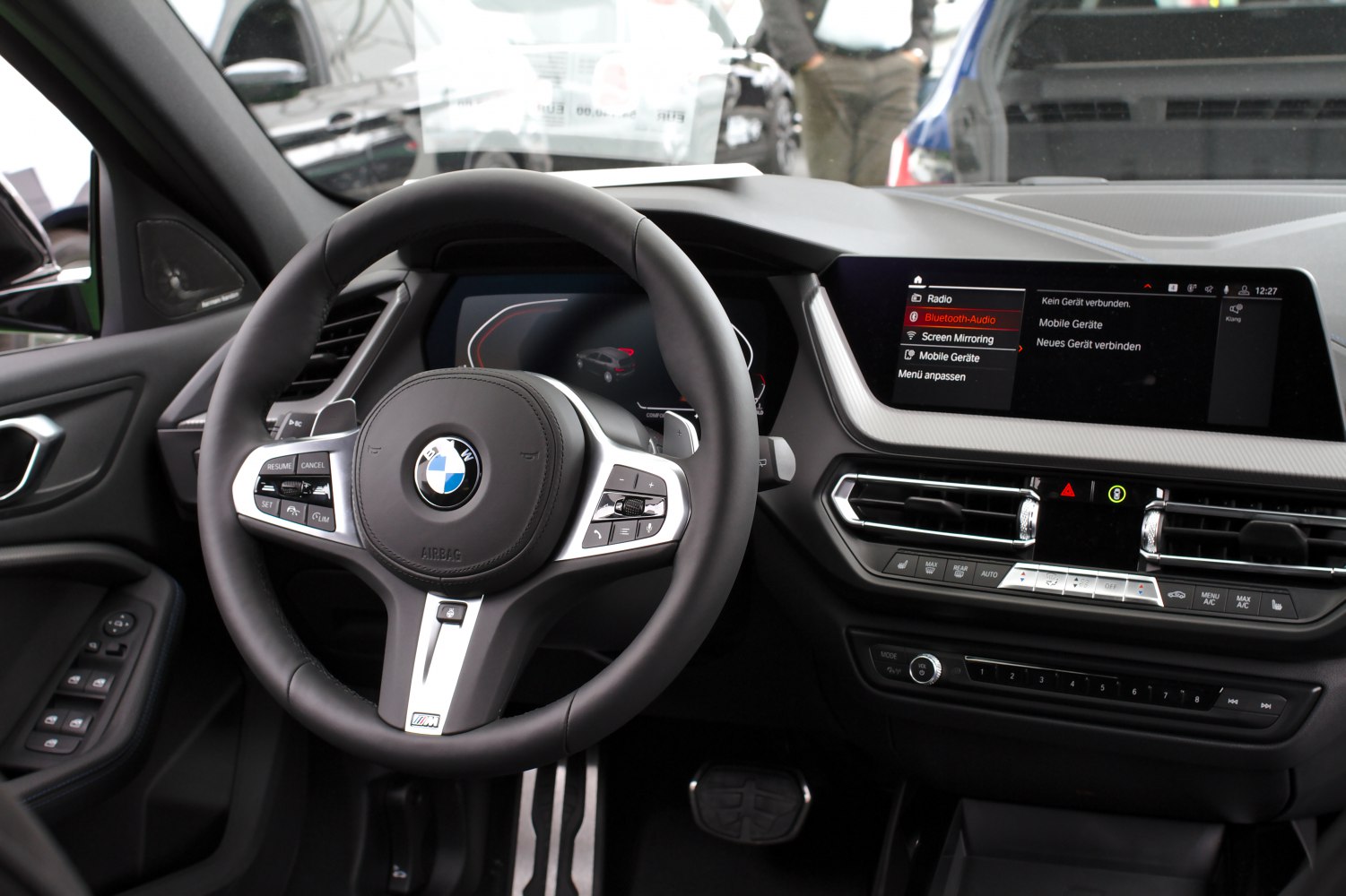 Digital instrument cluster and infotainment system with steering wheel controls