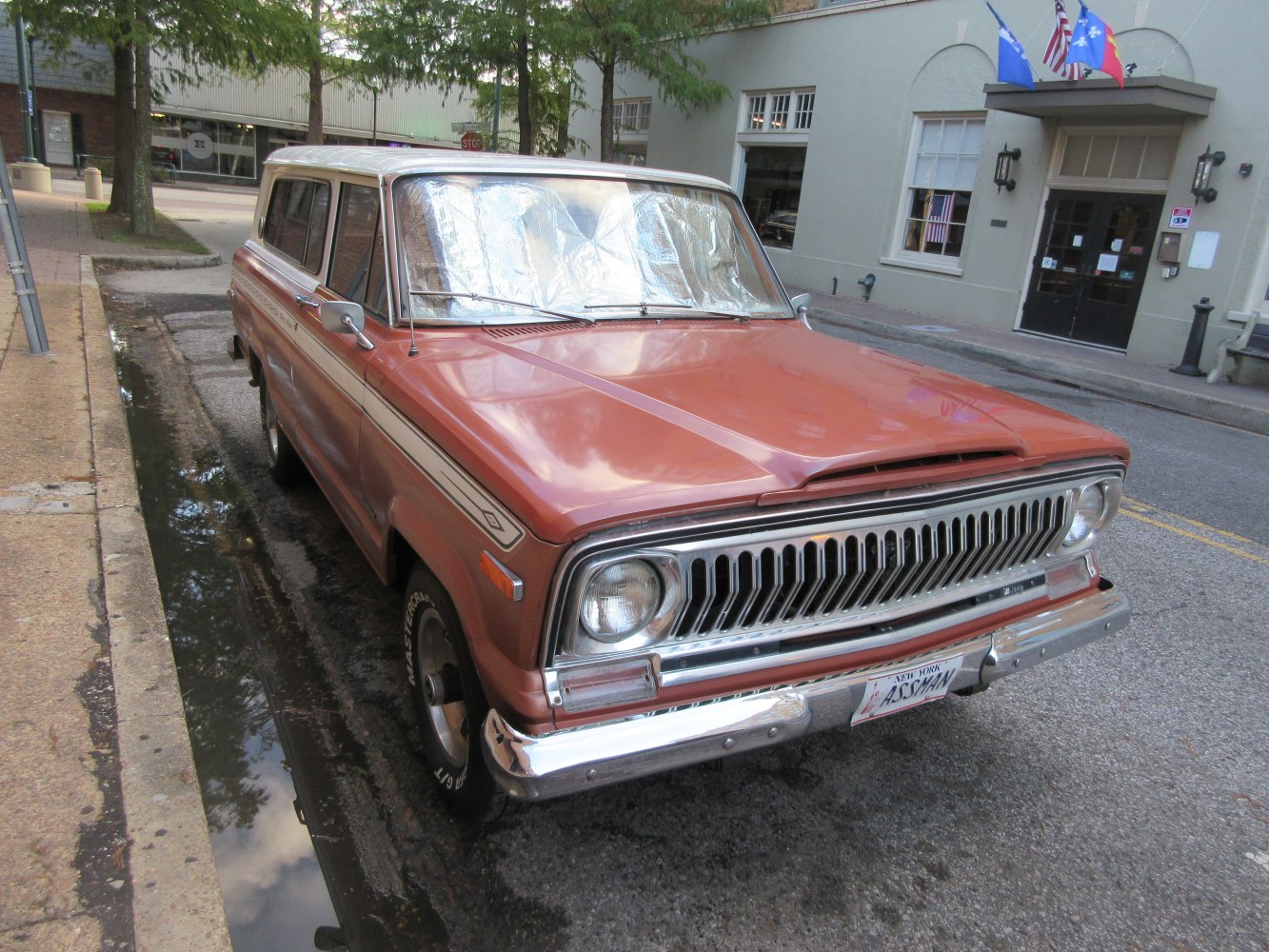 Front view showing chrome grille and round headlights of a vintage SUV.