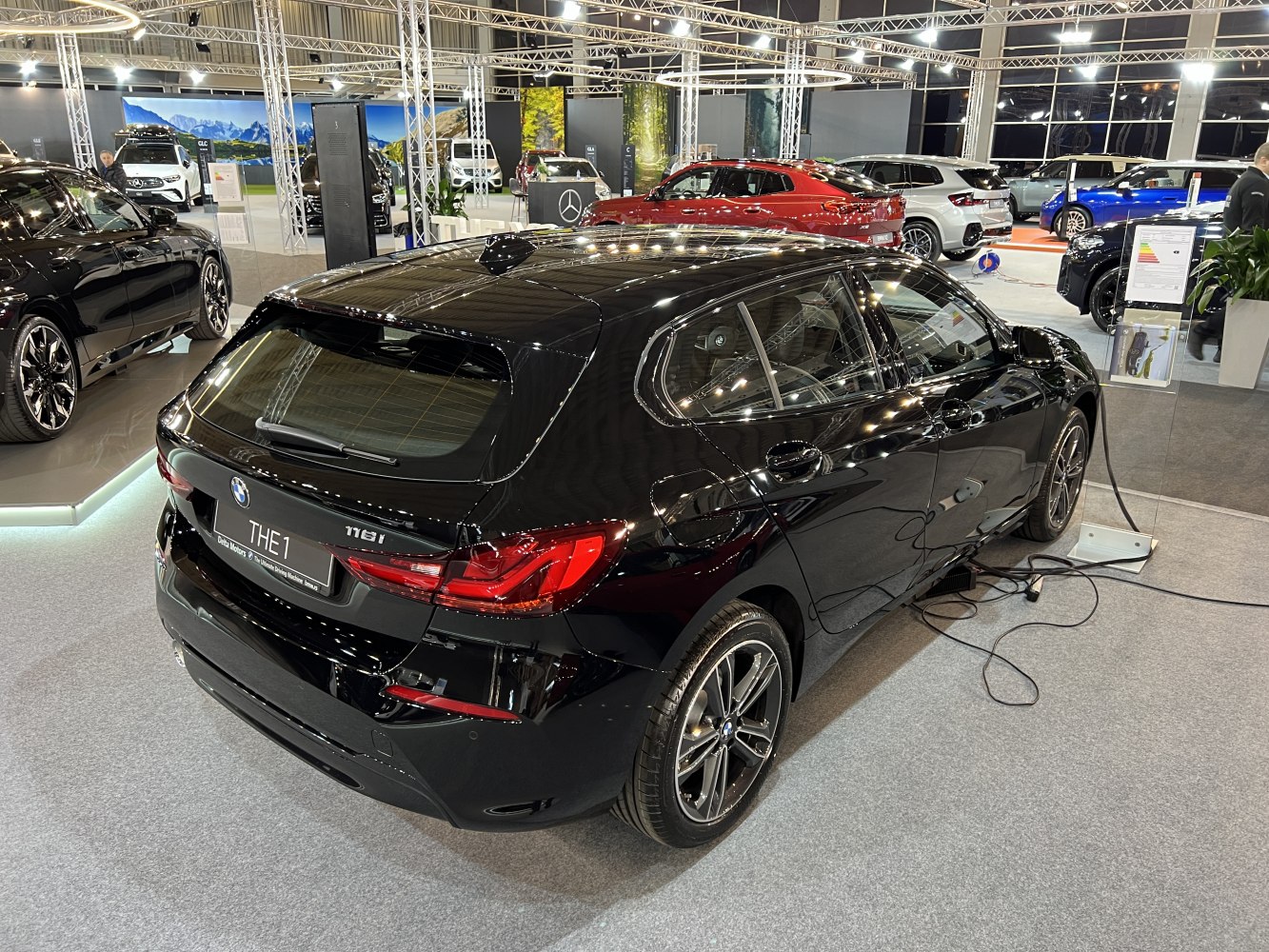 Rear and side profile of black hatchback with LED taillights and alloy wheels