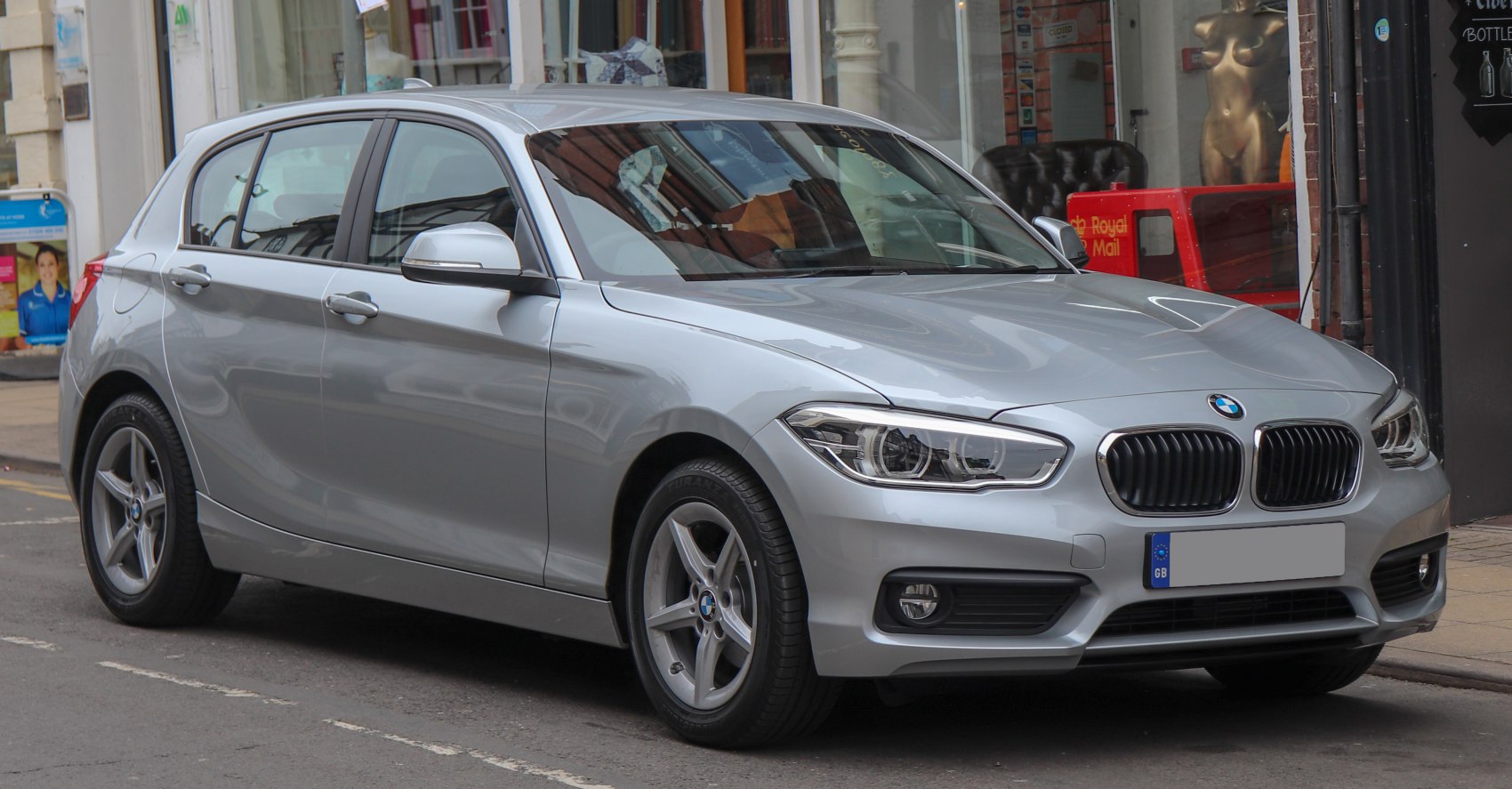 Silver 5-door hatchback front side view with modern headlights and kidney grille