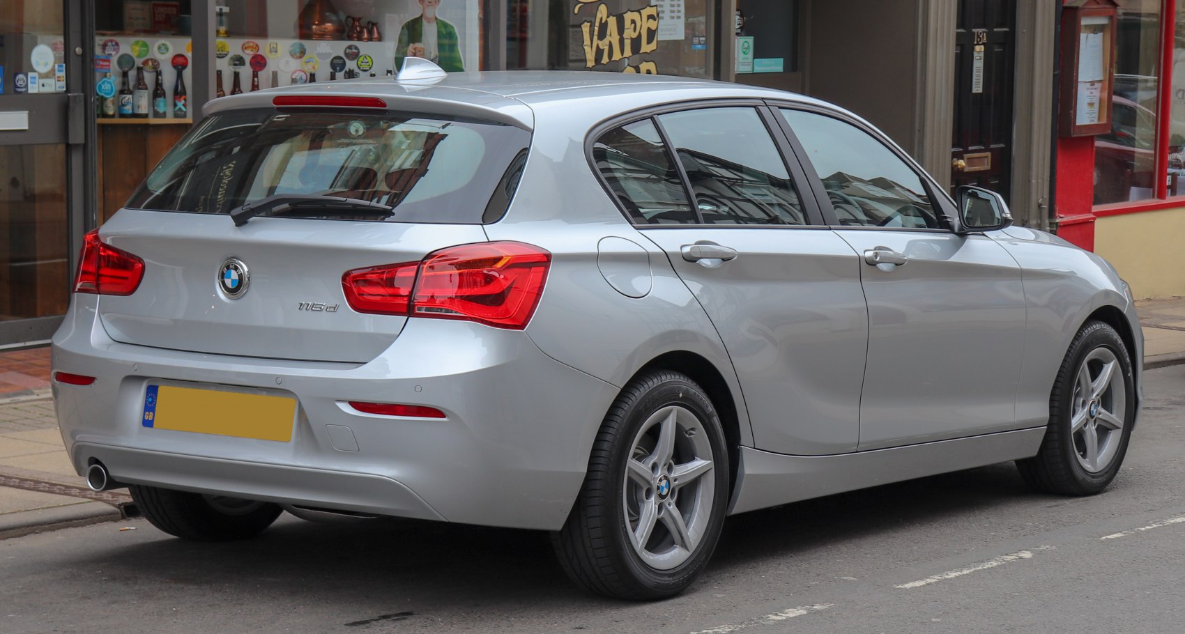 Rear-side view of silver 5-door hatchback with prominent taillights