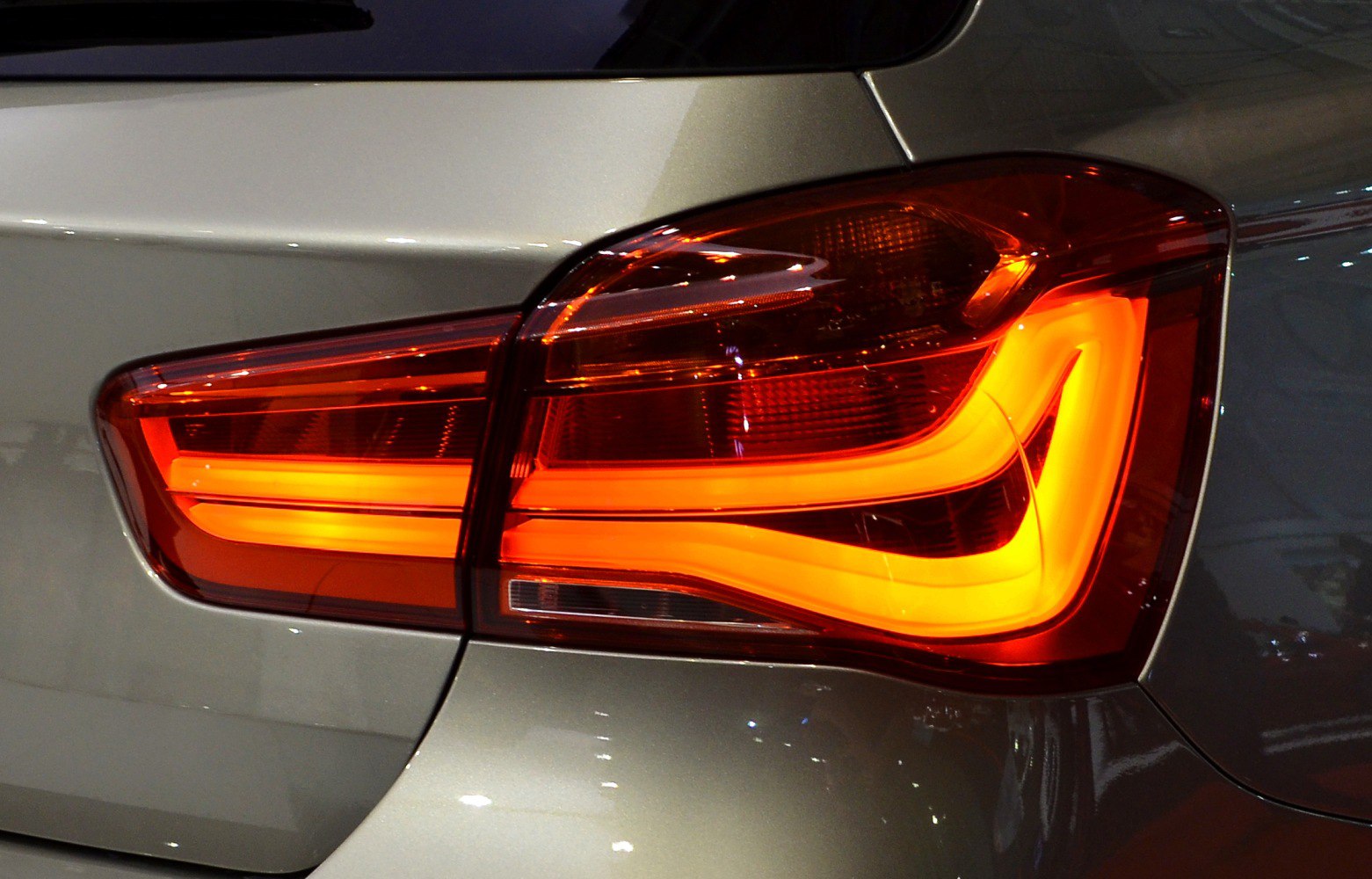Rear LED tail light design with distinctive illuminated patterns
