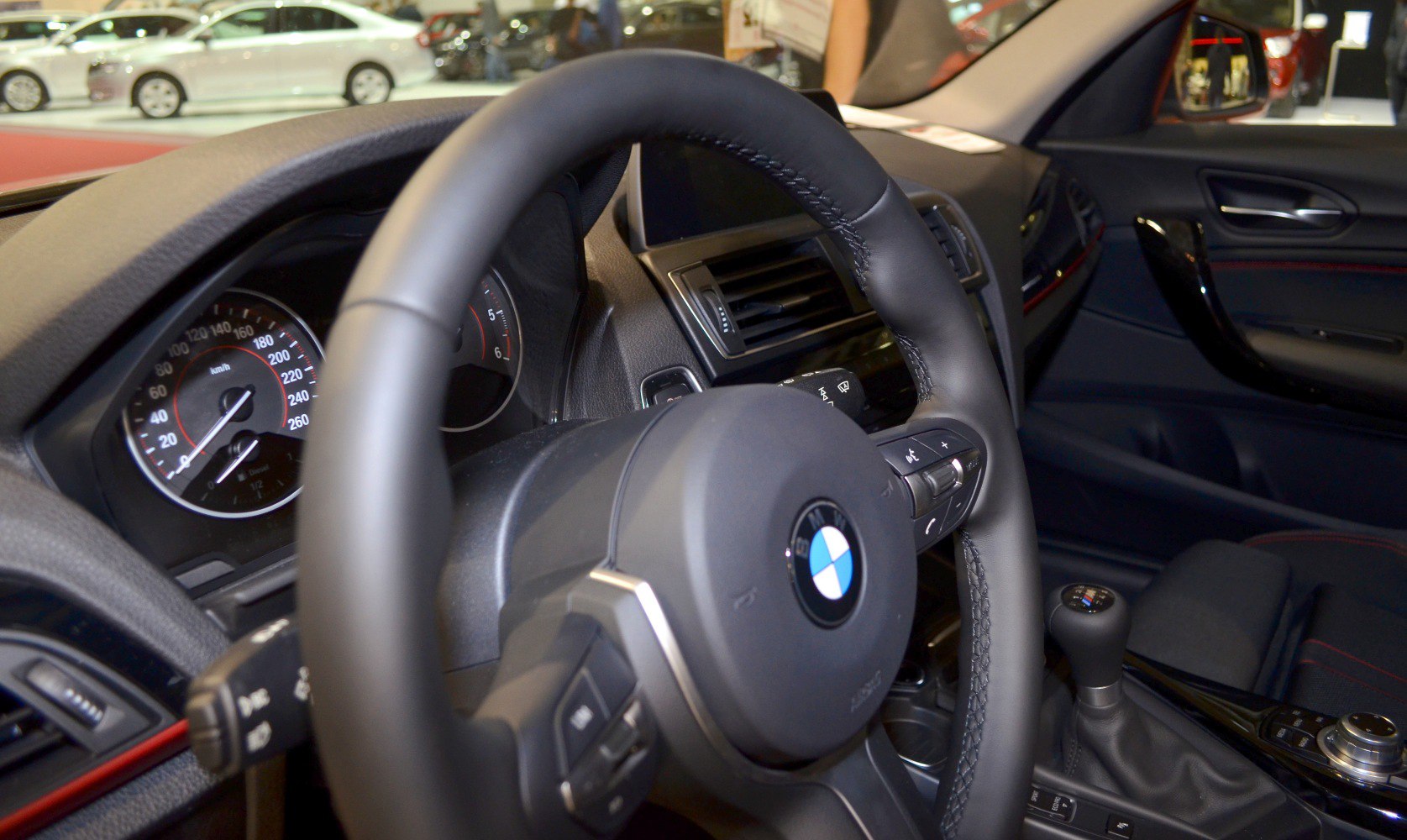 BMW steering wheel, dashboard with instrument cluster, manual gear shifter