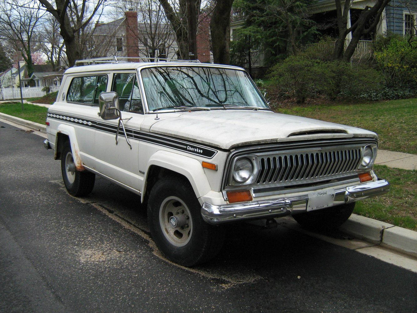 Front side view of classic SUV with distinctive grille and boxy body design