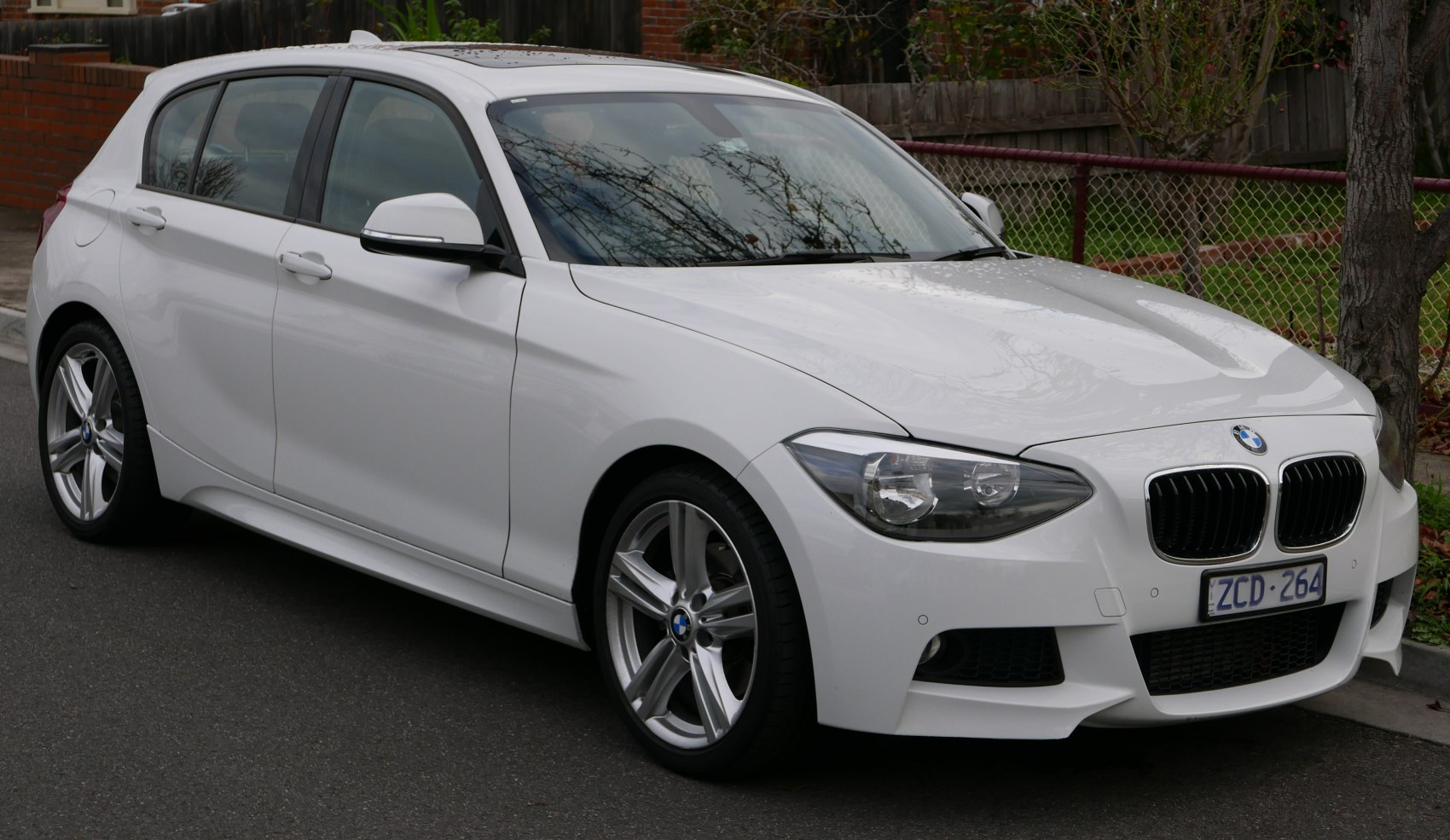 White 5-door hatchback with sporty alloy wheels and sleek design.