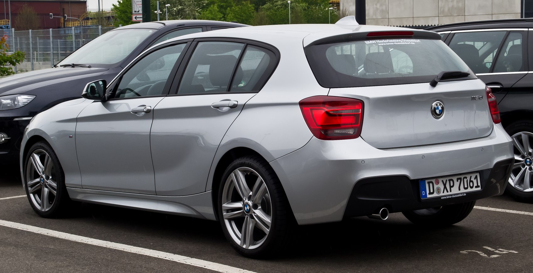 Rear and side view of hatchback with notable taillights and alloy wheels