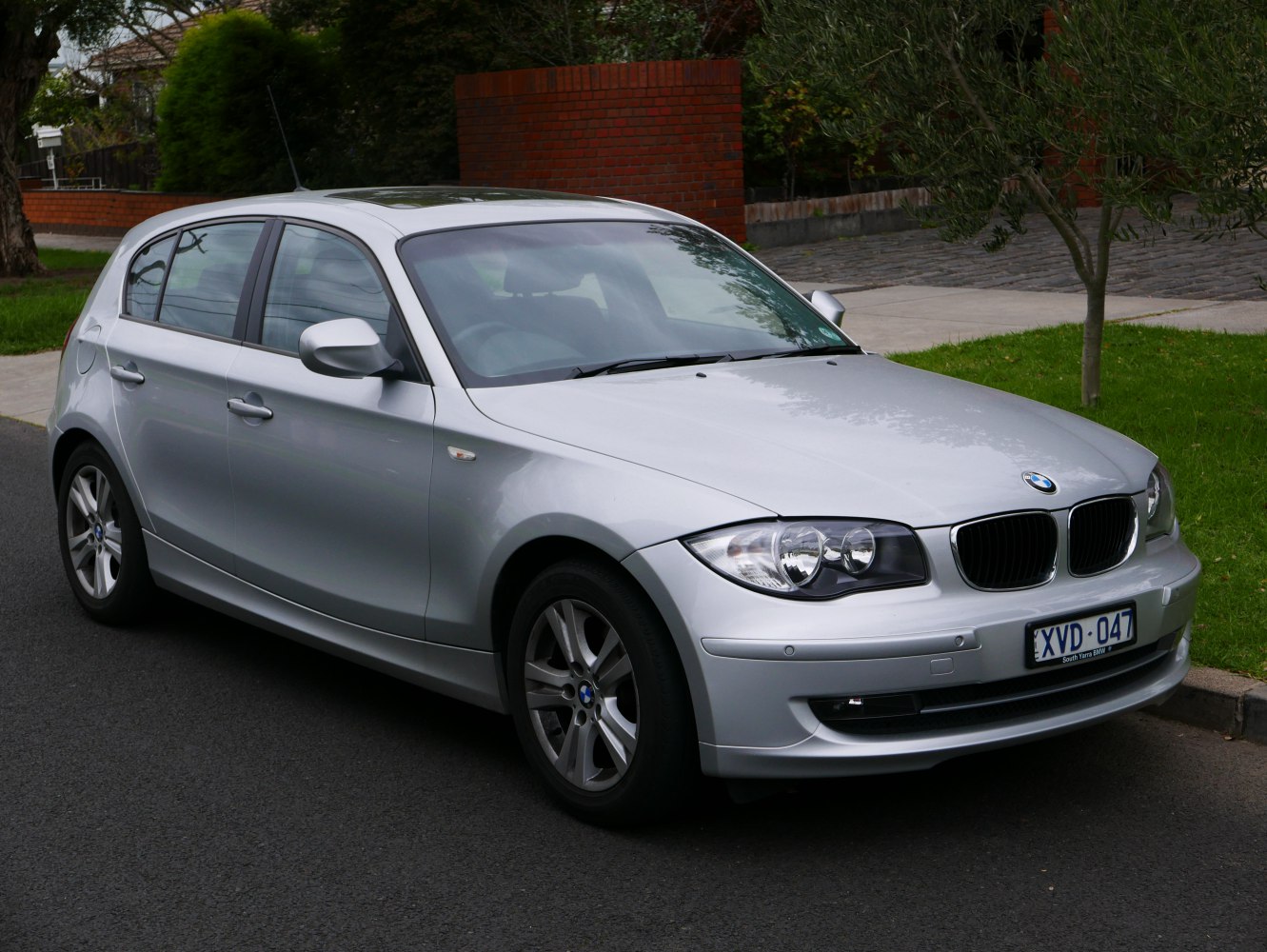 Silver 5-door hatchback with front side view and alloy wheels