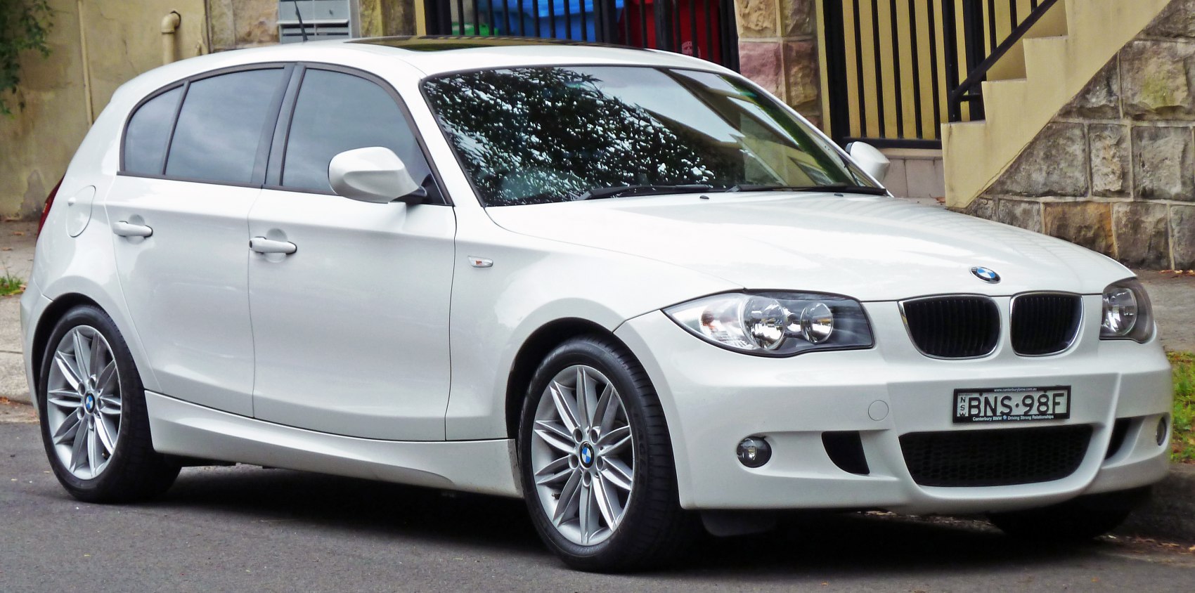Front and side profile of a 5-door compact hatchback with kidney grille and alloy wheels