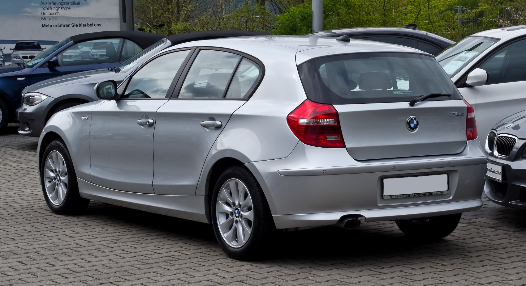 Silver hatchback with 5 doors and modern taillights