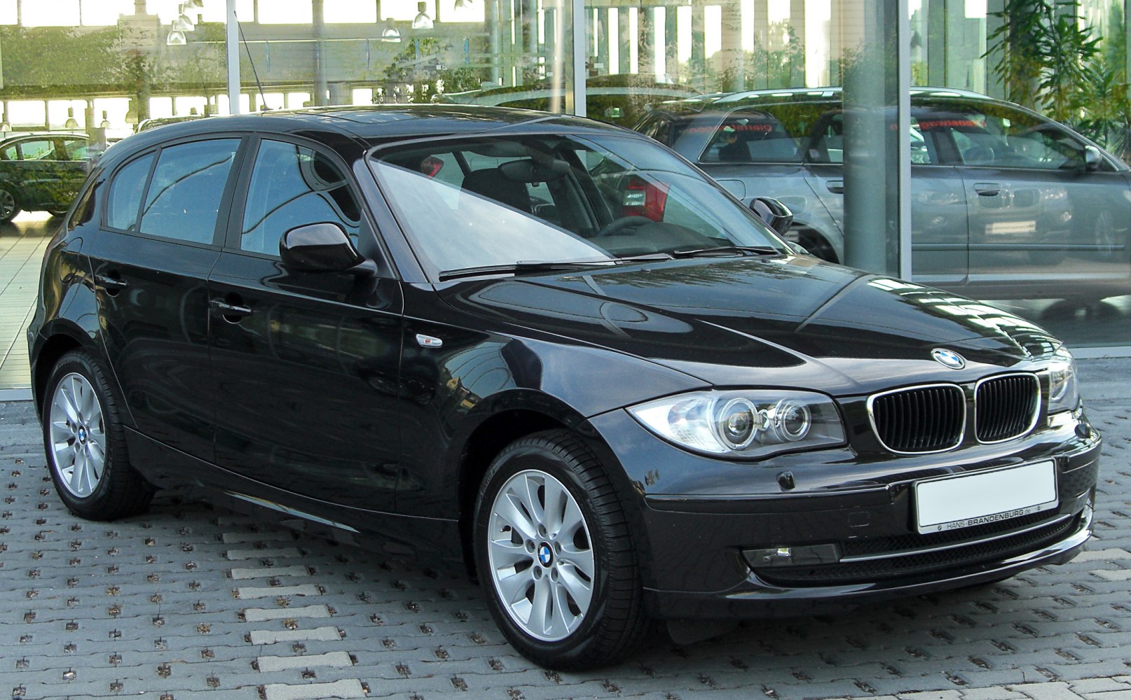 5-door hatchback front-side view with distinctive headlights and kidney grille