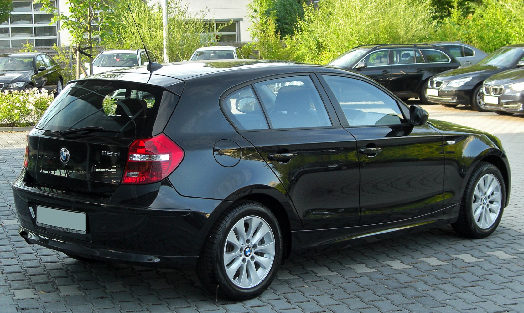 Rear side view of 5-door hatchback with alloy wheels