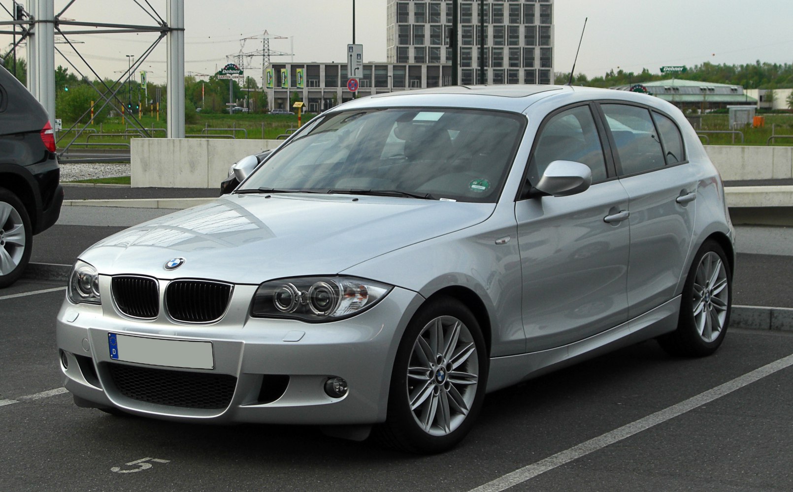 Silver 5-door hatchback front-side view with alloy wheels