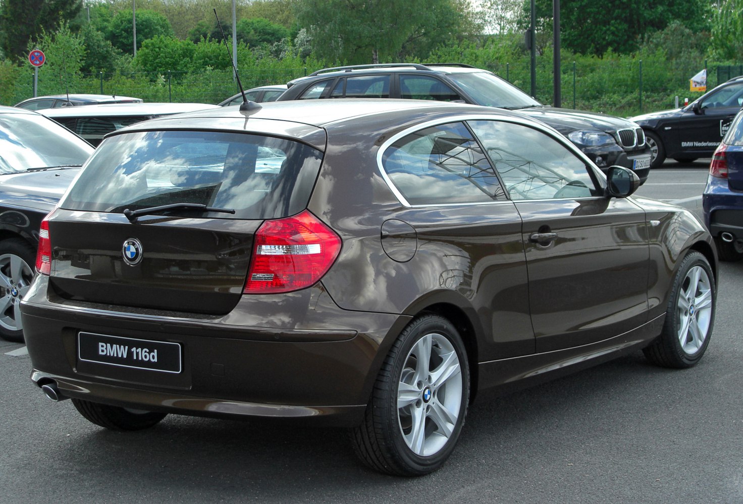 Rear view of a 3-door hatchback with distinct tail lights and alloy wheels