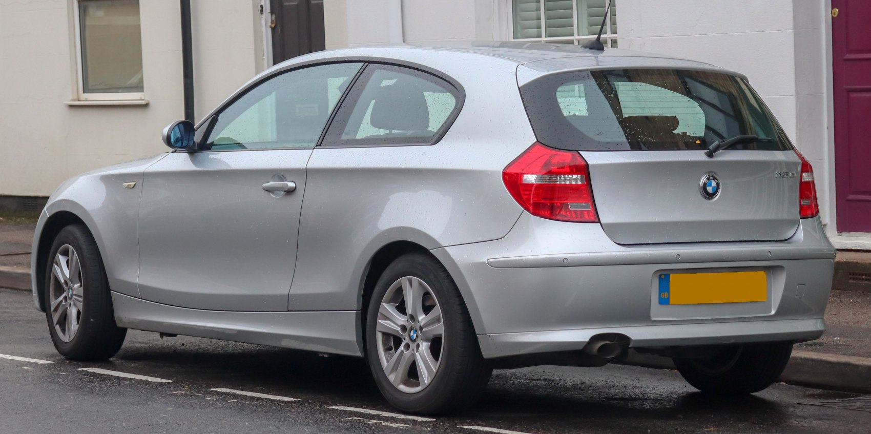 Silver 3-door hatchback rear and side view with distinct tail lights