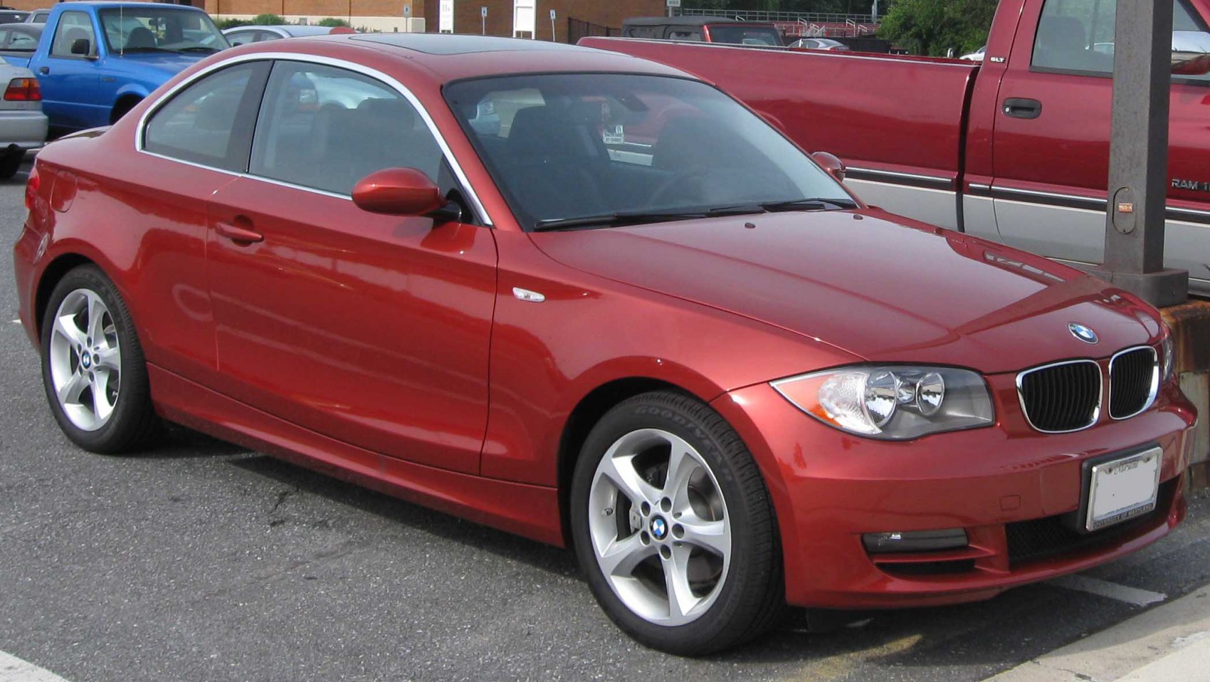 Red coupe with alloy wheels and coupe body style