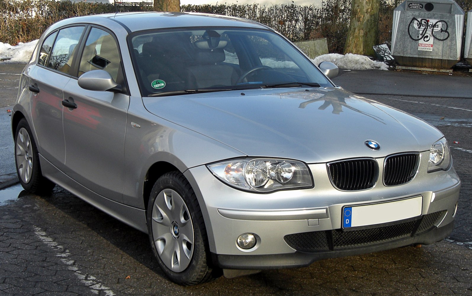Silver compact hatchback with front grille and headlights