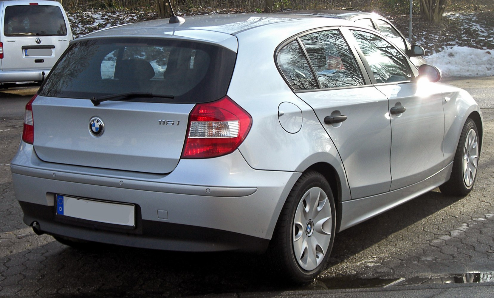 Silver hatchback rear view with distinctive tail lights and rear window