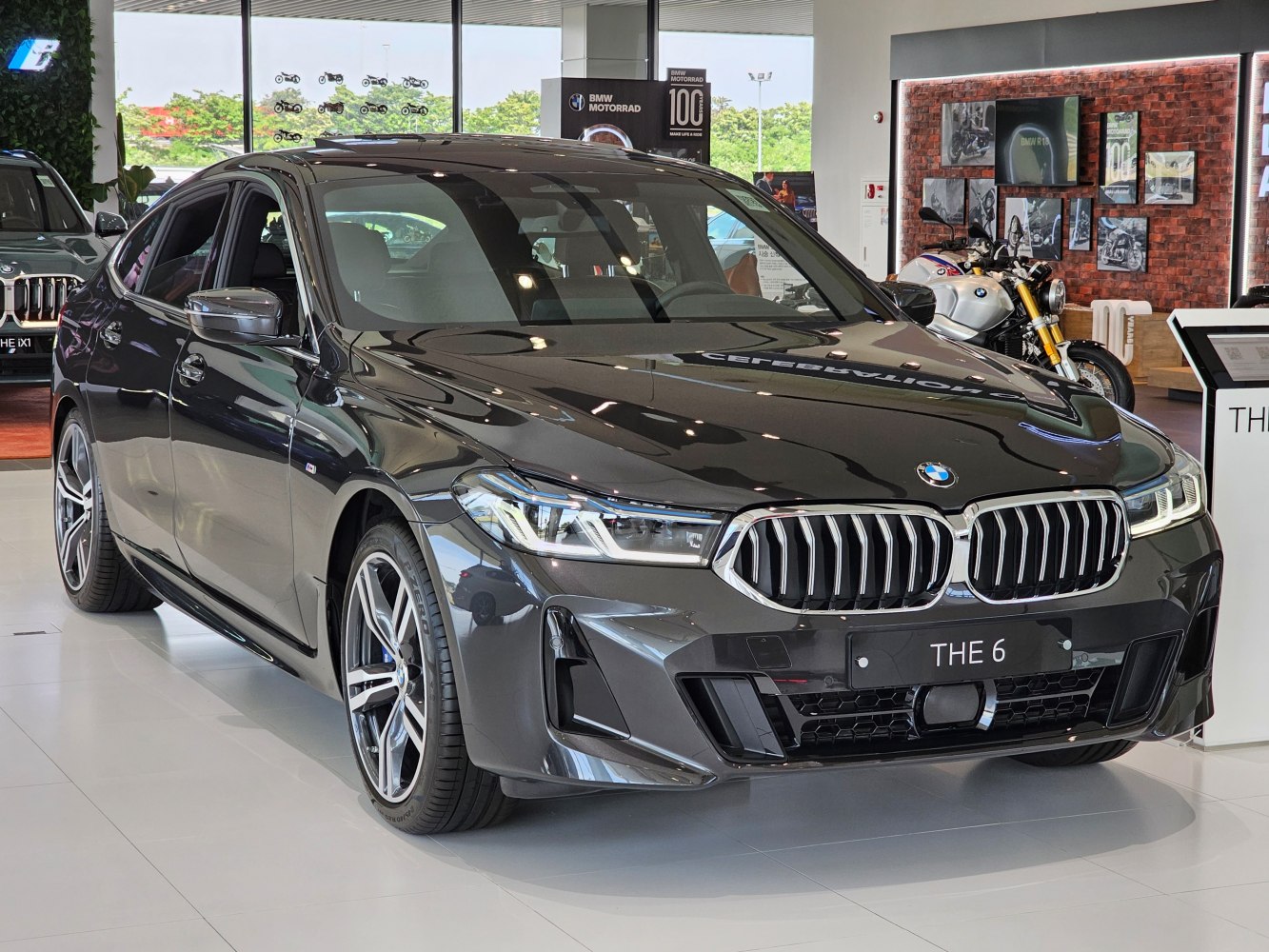 Luxury sedan front view with kidney grille and LED headlights