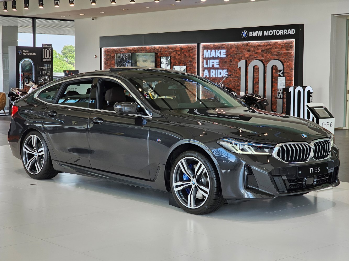 Front and side view of sleek sedan with sporty alloy wheels