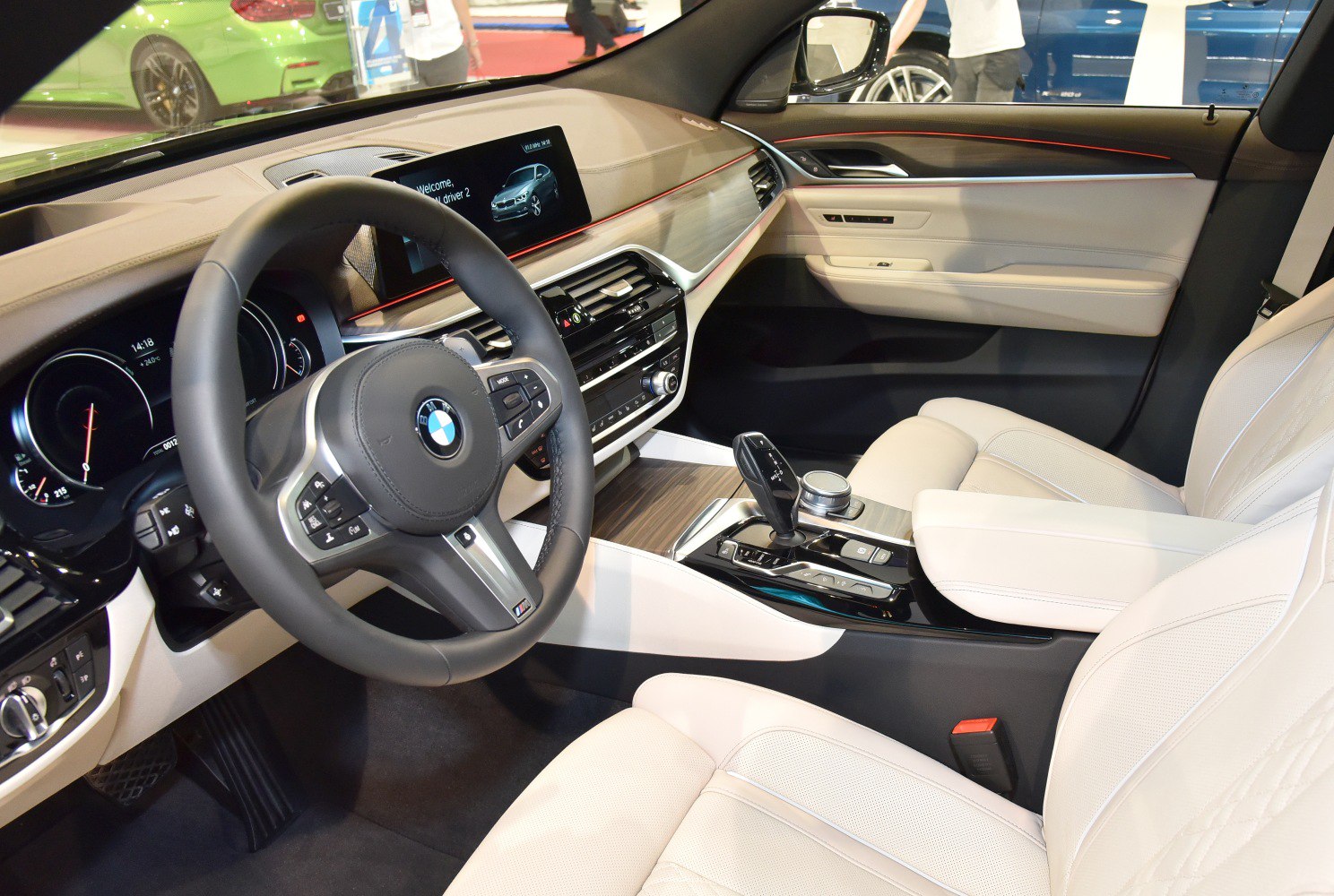Modern luxury car interior with digital dashboard and steering wheel