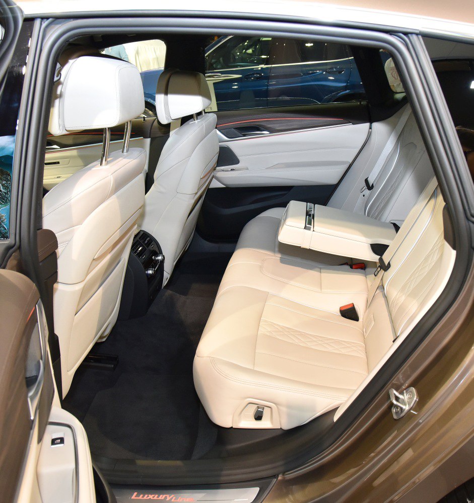 Spacious cream leather rear seats with armrest and luxury features