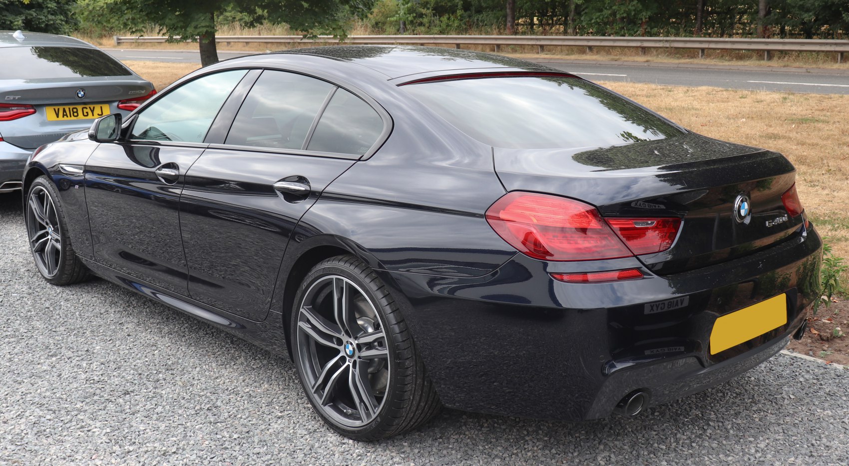 Rear and side view of sleek luxury Gran Coupe with alloy wheels