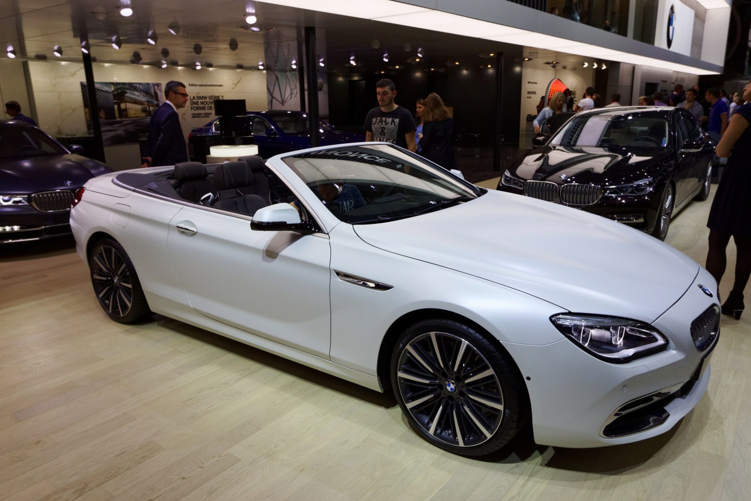 Convertible luxury car with open roof and alloy wheels