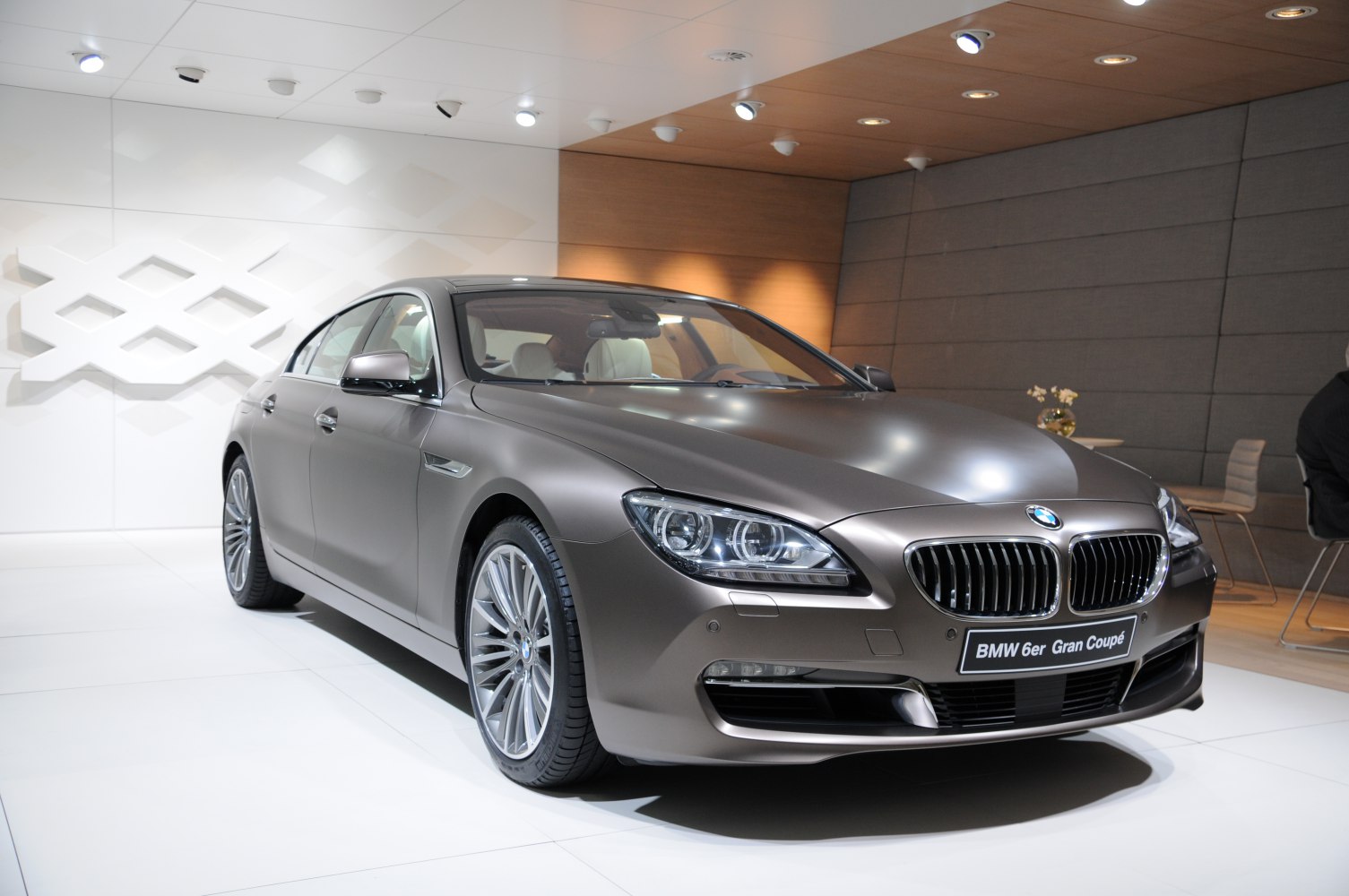 Front view of a luxury four-door coupe with distinctive headlights