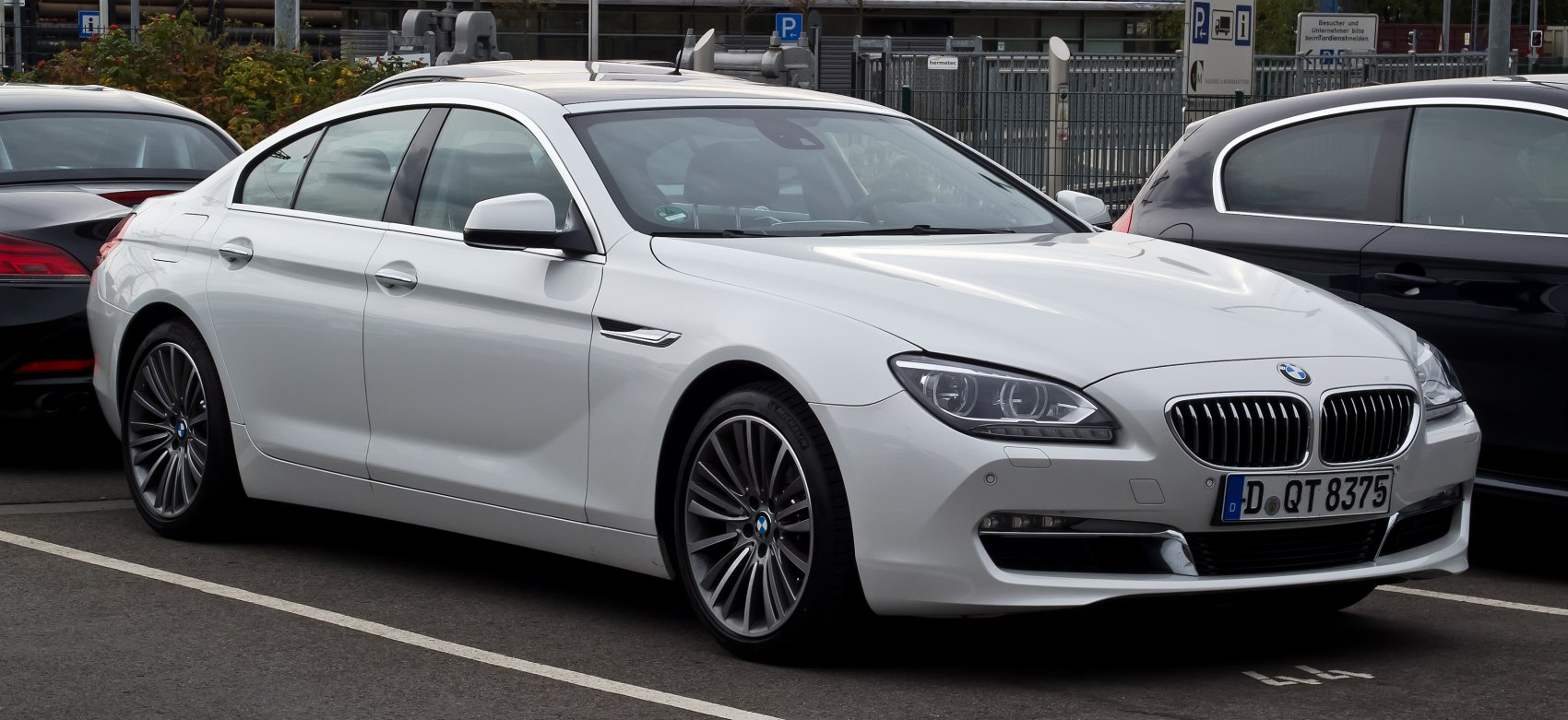 Front side view with sleek headlights and sporty alloy wheels