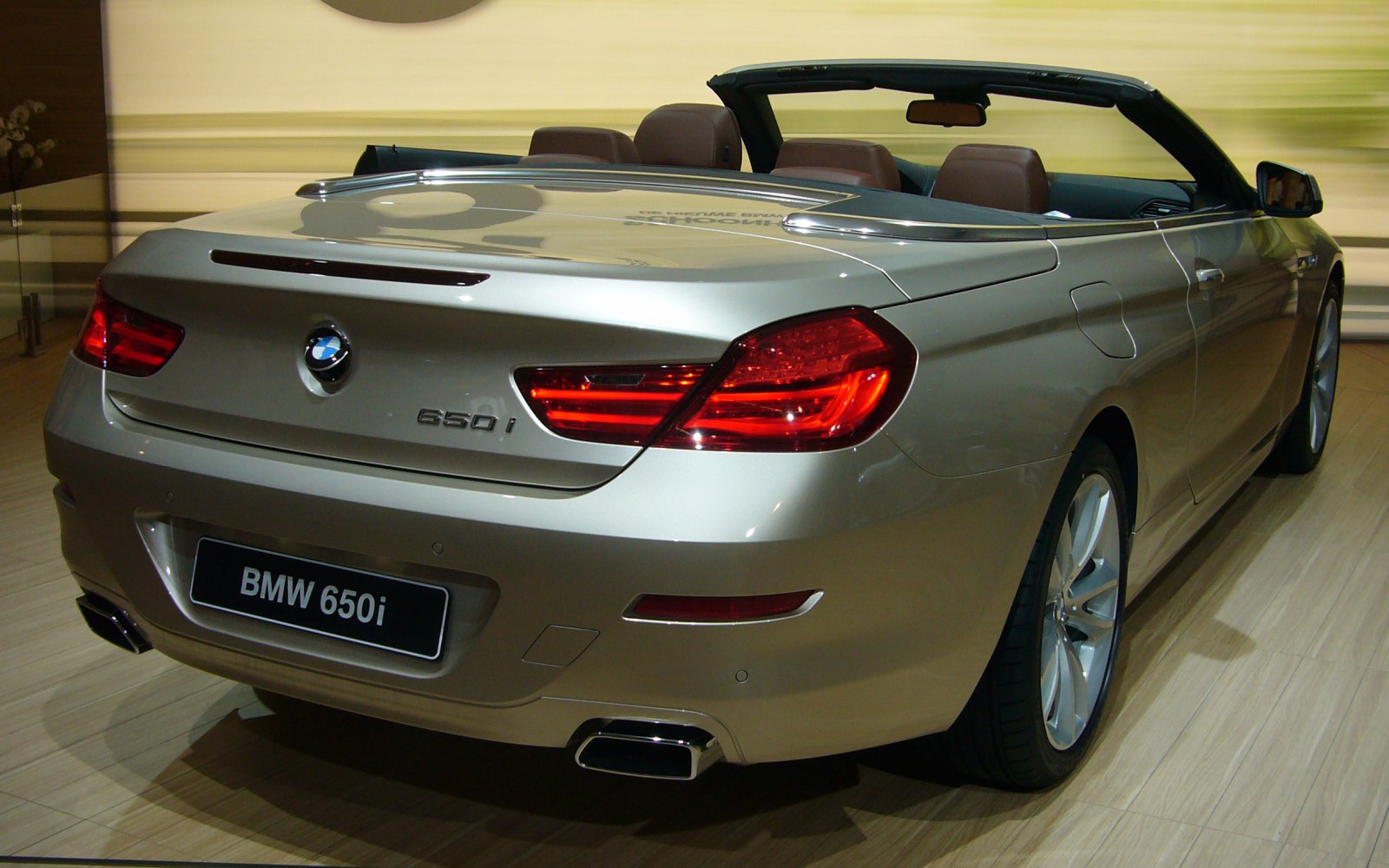 Rear view of convertible with prominent tail lights and open roof