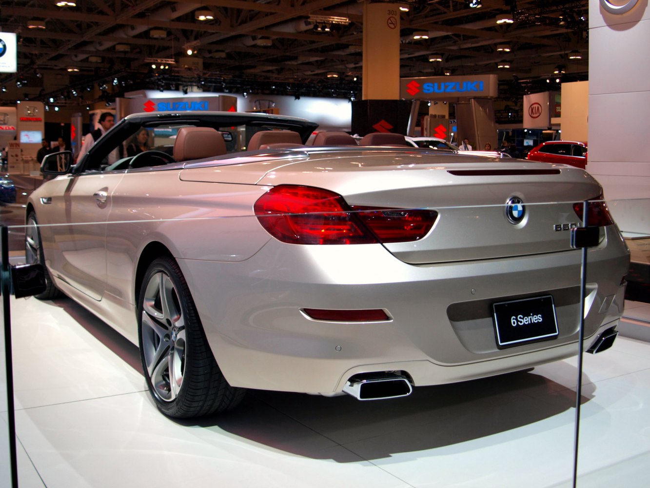 Rear view of a luxury convertible with sleek taillights and dual exhaust tips