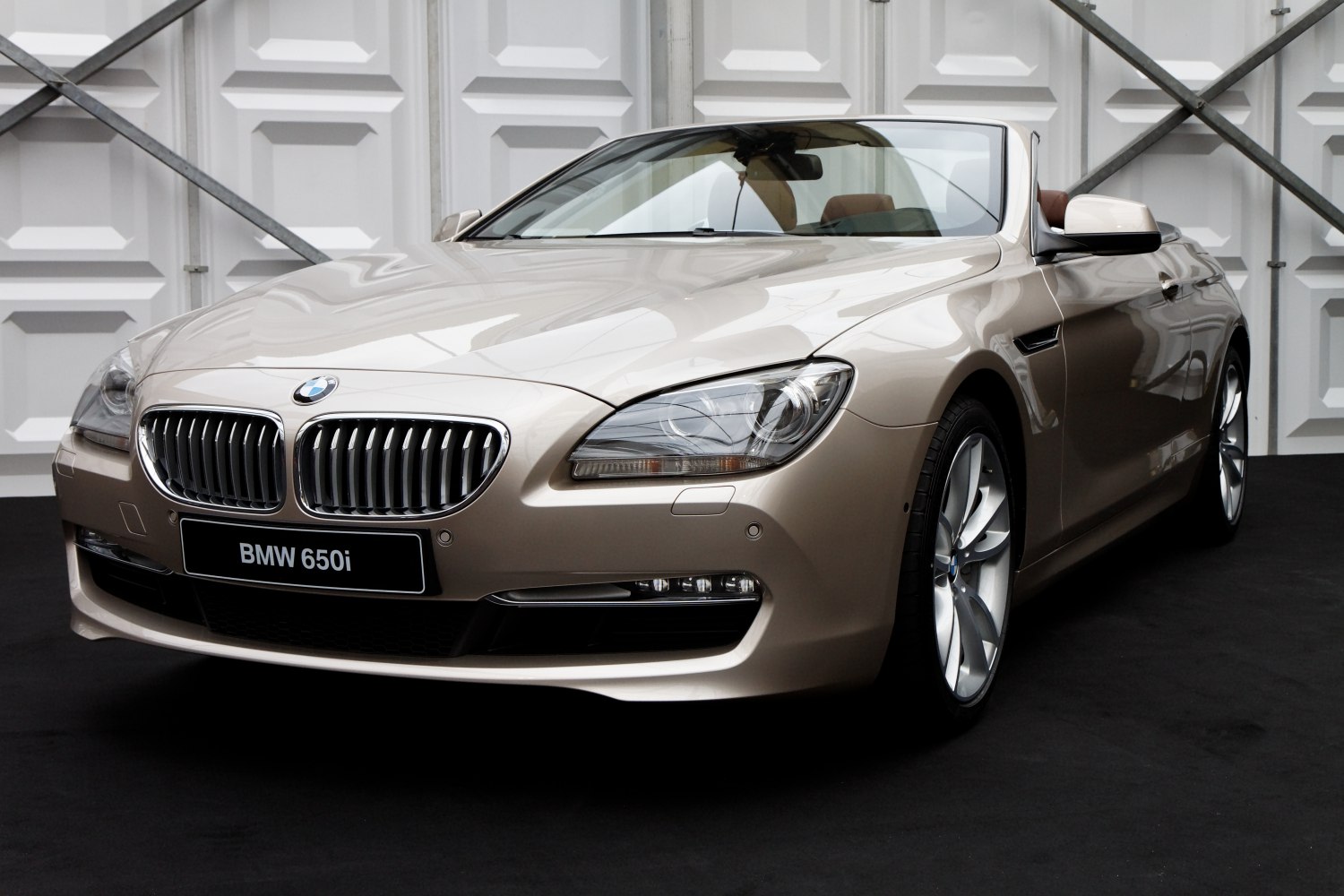Front view with kidney grille and sleek headlights of convertible car
