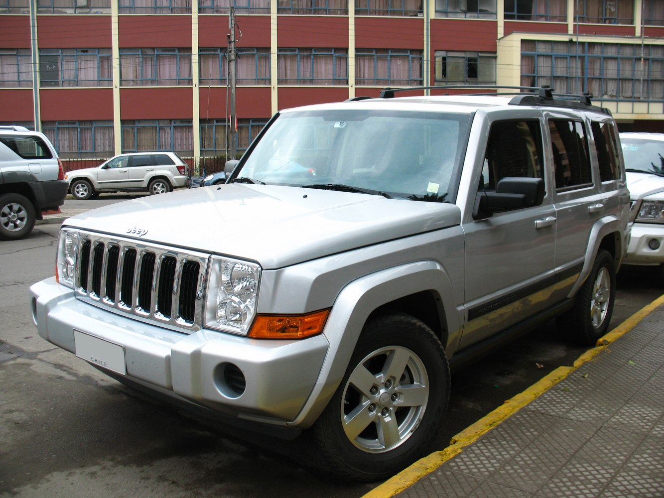 Silver SUV with seven-slot grille and boxy design