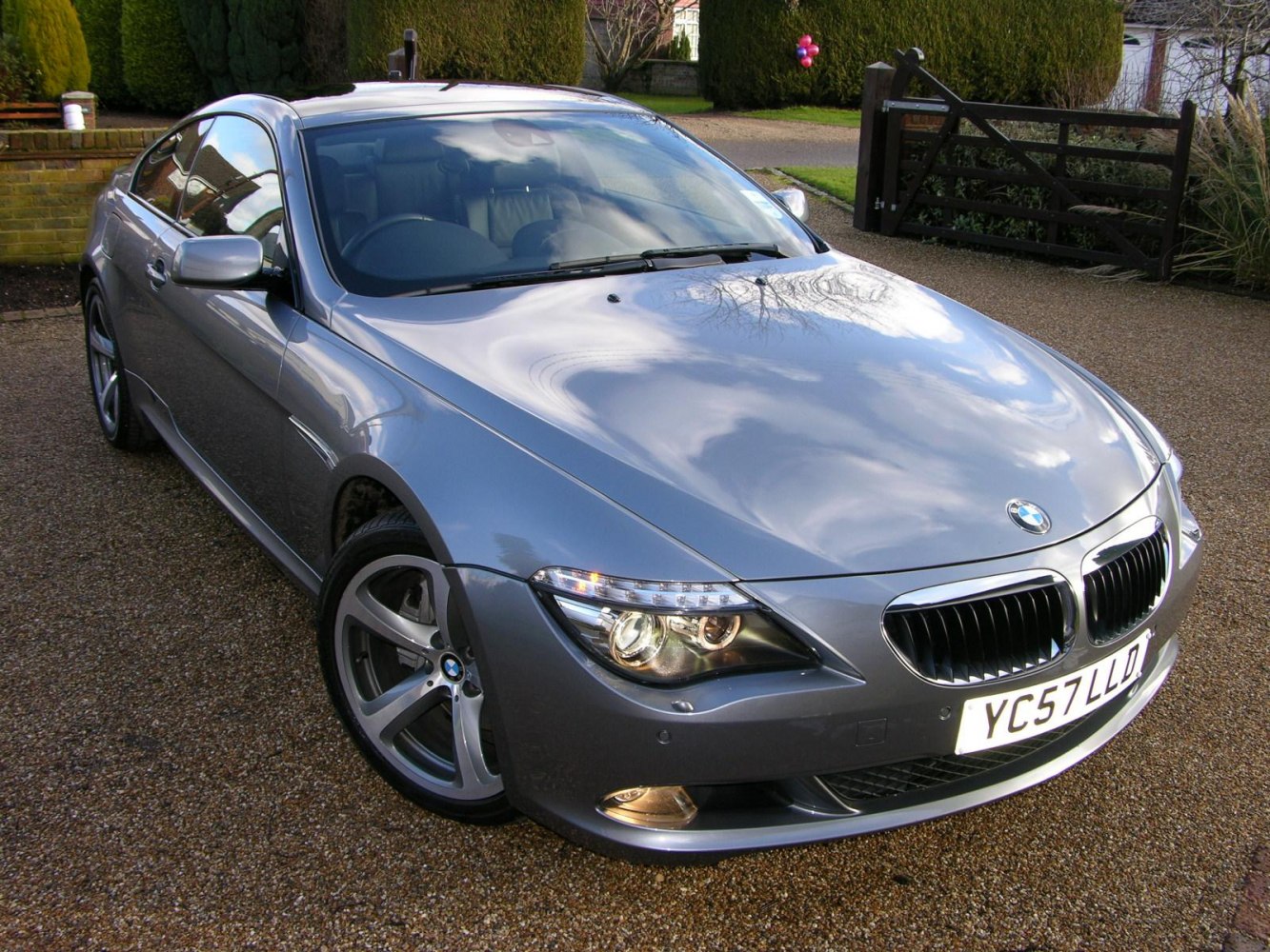 Front angled view with LED headlights and alloy wheels