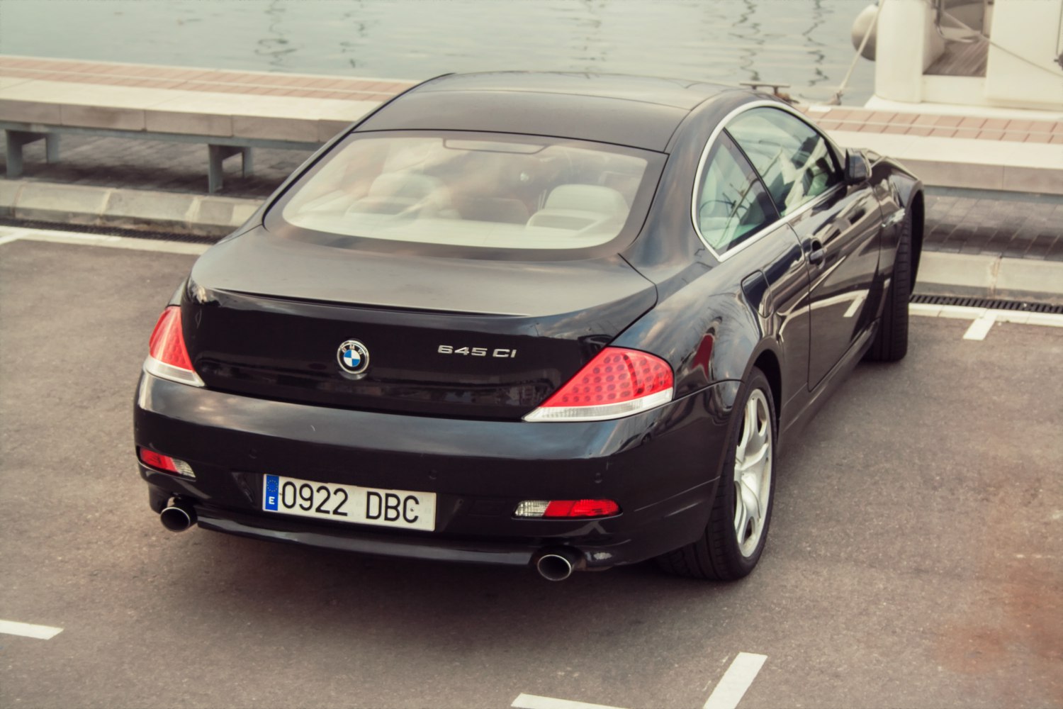 Rear view of luxury coupe with dual exhaust and distinctive taillights