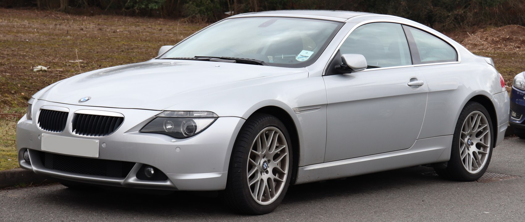 Silver coupe with sharp front fascia and multi-spoke alloy wheels