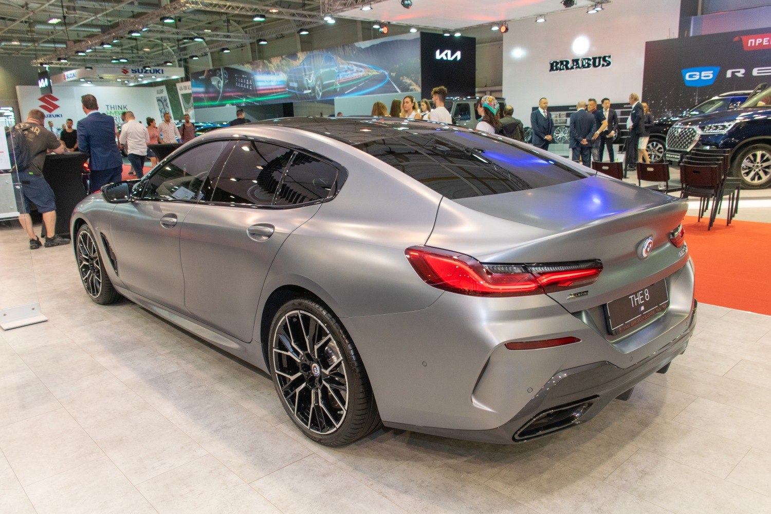 Rear and side of sporty luxury sedan with LED tail lights and black alloy wheels.