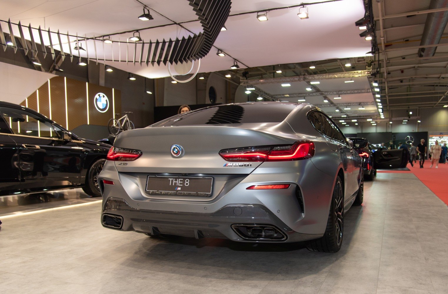 Rear view with illuminated taillights and dual exhausts