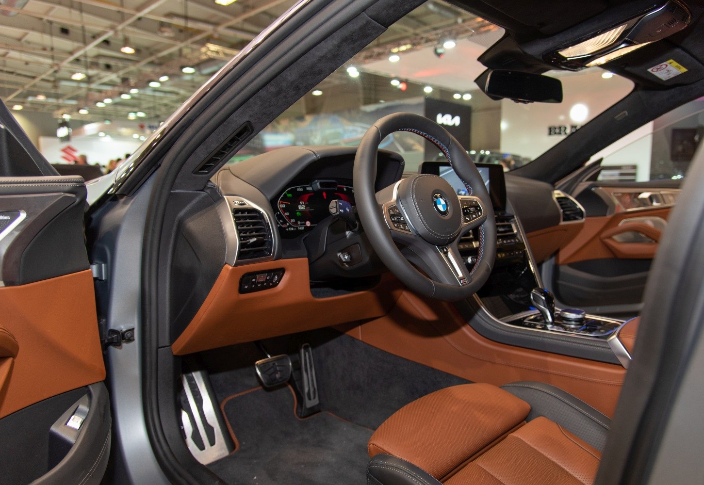 Digital dashboard and leather steering wheel with brown leather seating